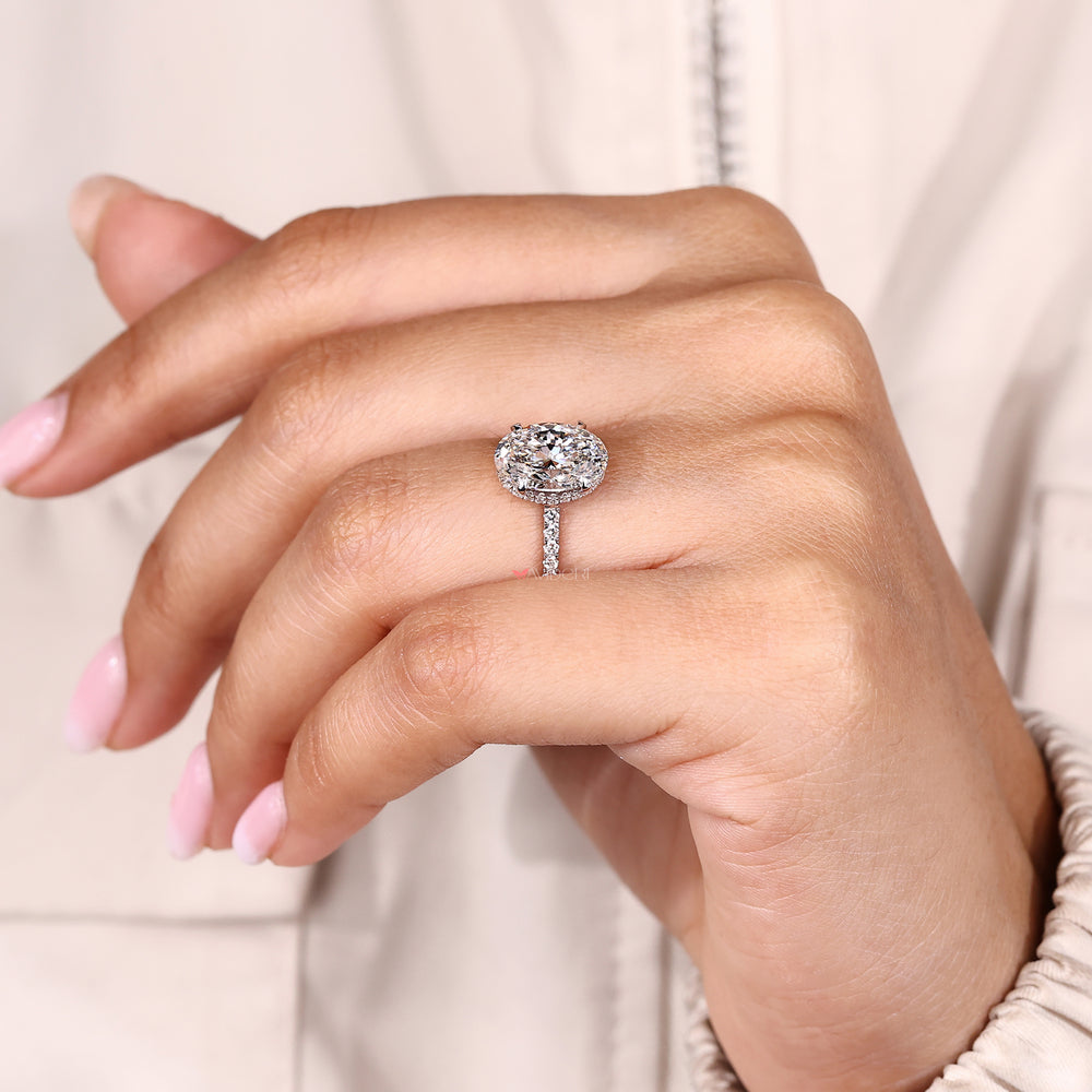 Oval lab grown diamond ring with open gallery.