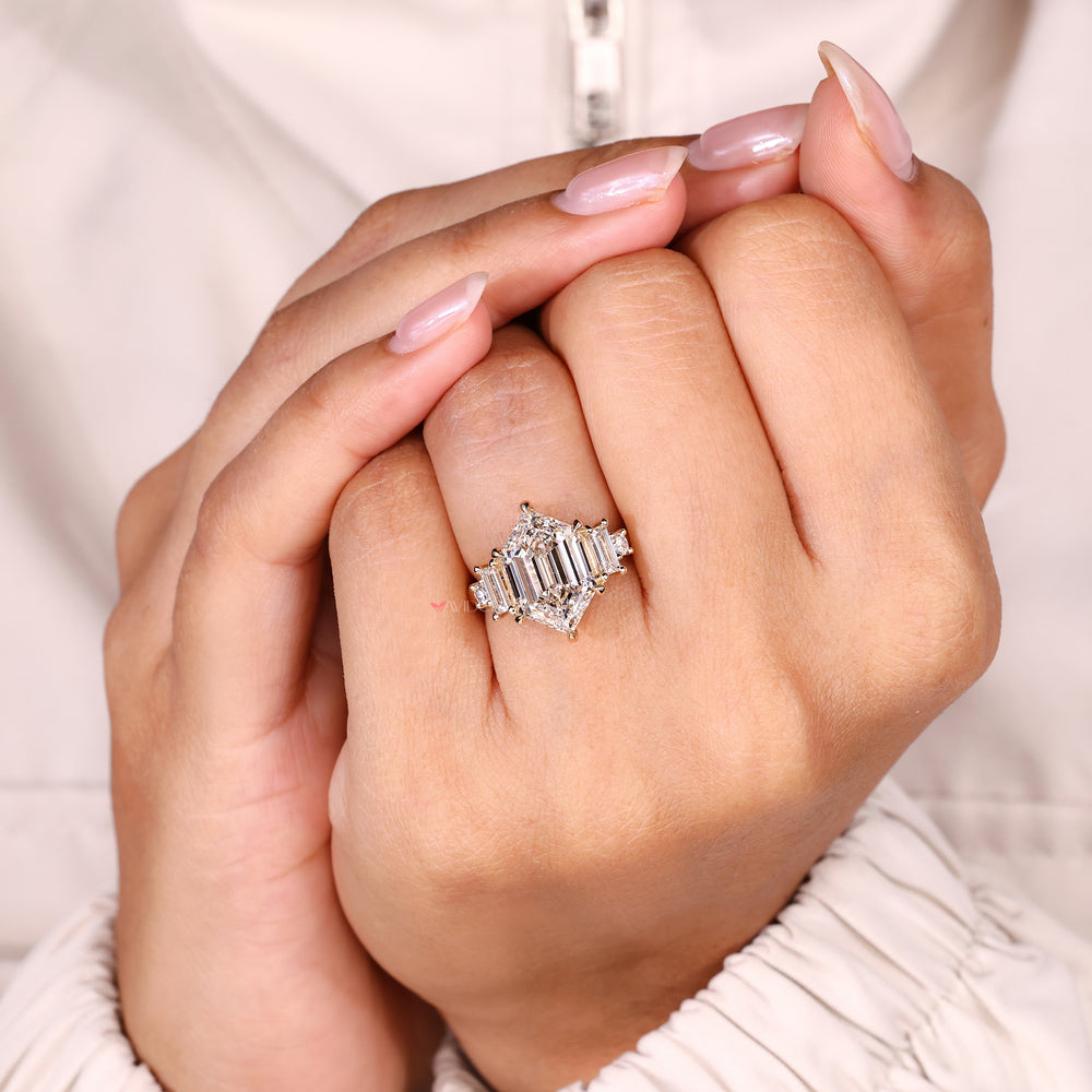 Five stone hexagon ring with side stone design.
