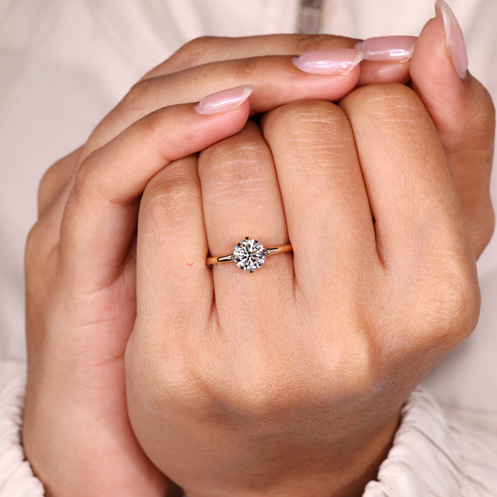 Round cut diamond ring with modern bypass style setting.
