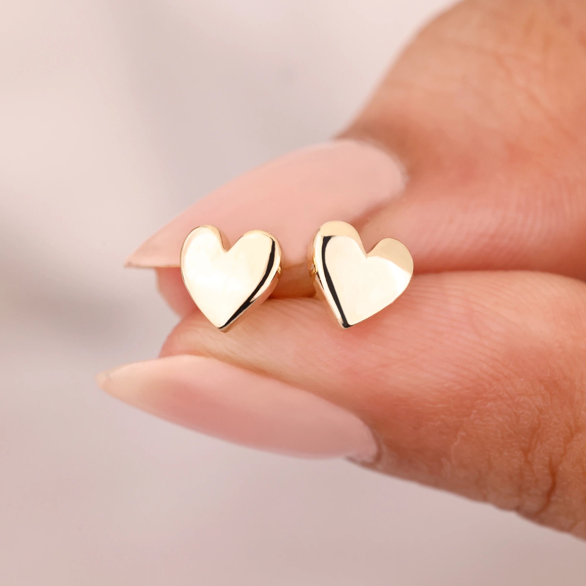 Yellow gold earrings with screw back stud earrings.