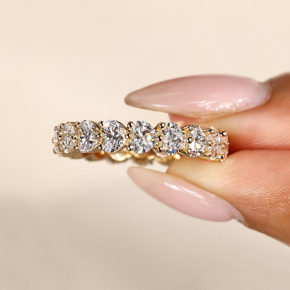 Heart diamond band with shared prong setting.
