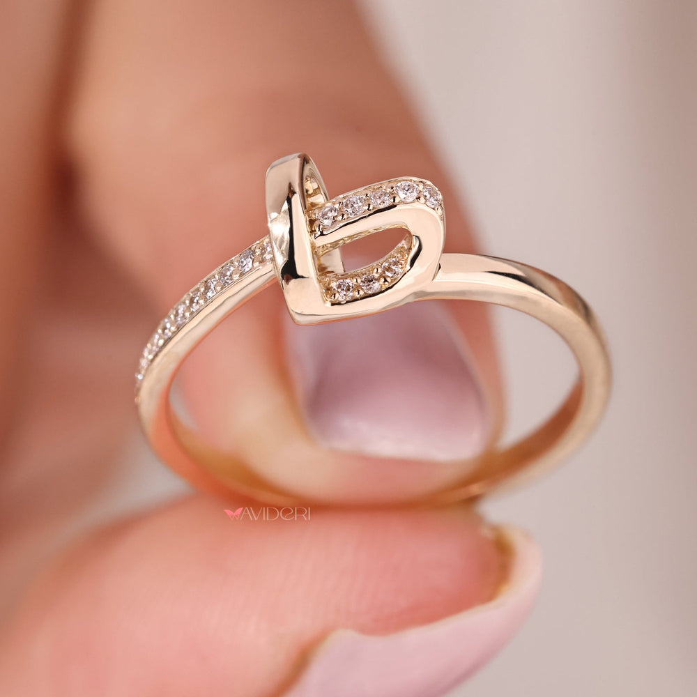 Yellow gold wedding band handcrafted with a symbolic knot pattern.
