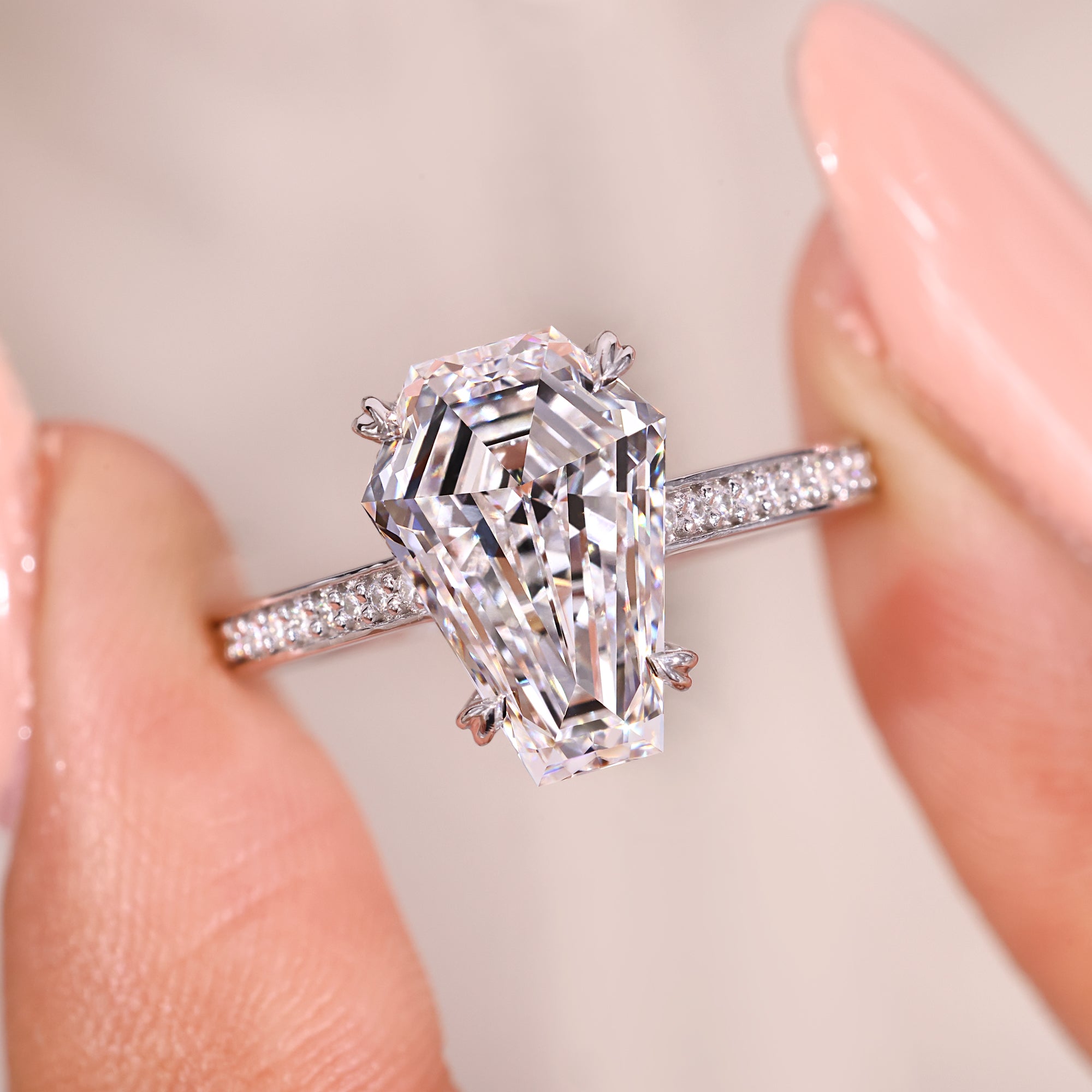 Heart shape prong setting ring with small pave diamonds.