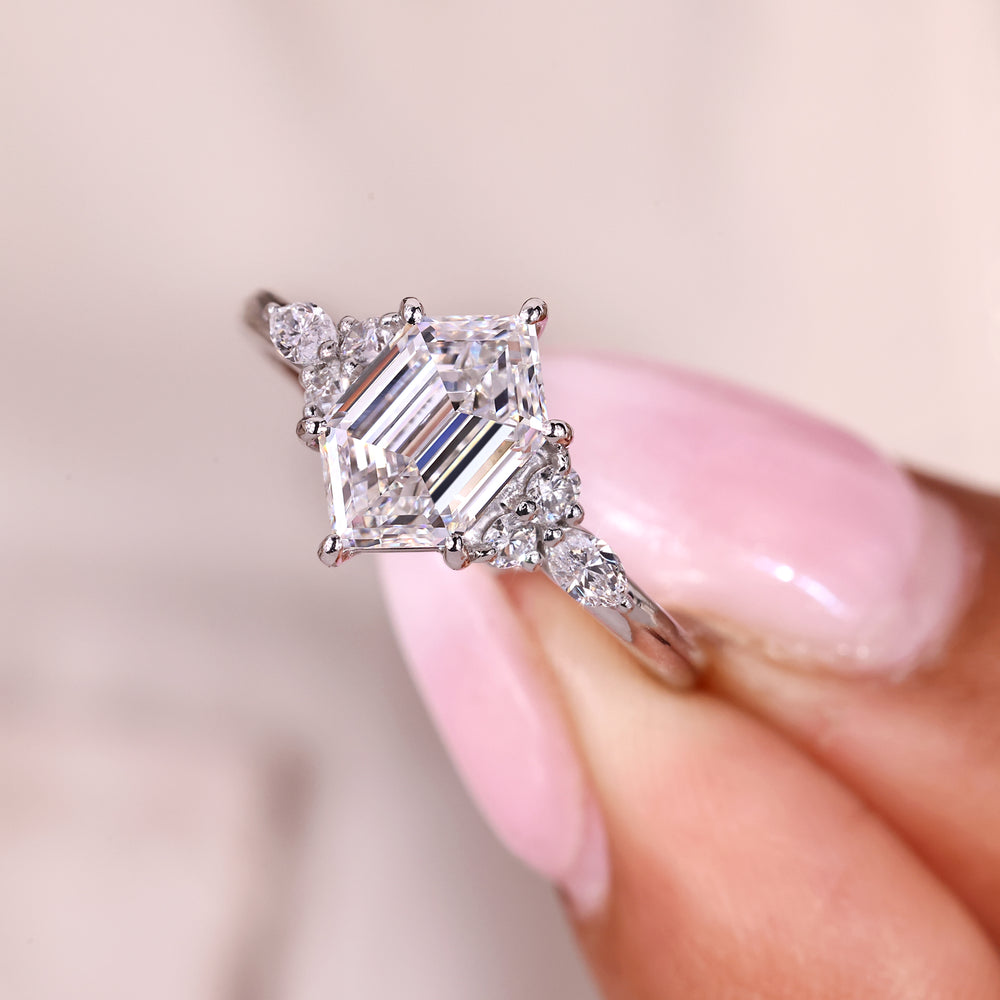 Seven stone ring with marquise and round side stones.