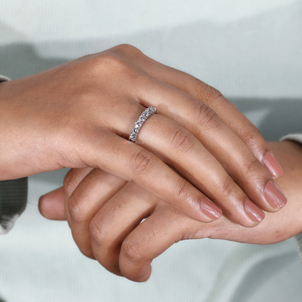 White gold wedding band with seven stone band.