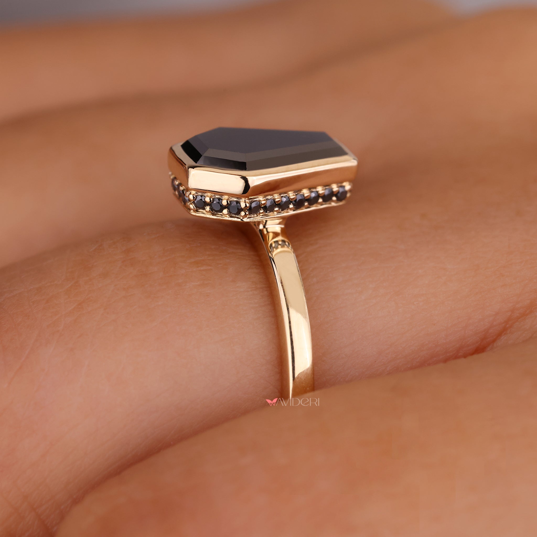 Bright diamonds frame the round cut hidden halo engagement ring beautifully.

