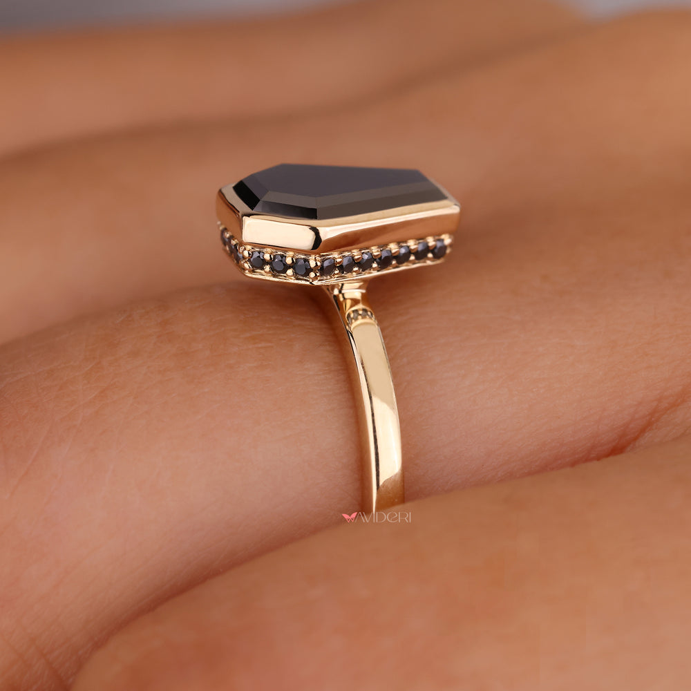 Bright diamonds frame the round cut hidden halo engagement ring beautifully.
