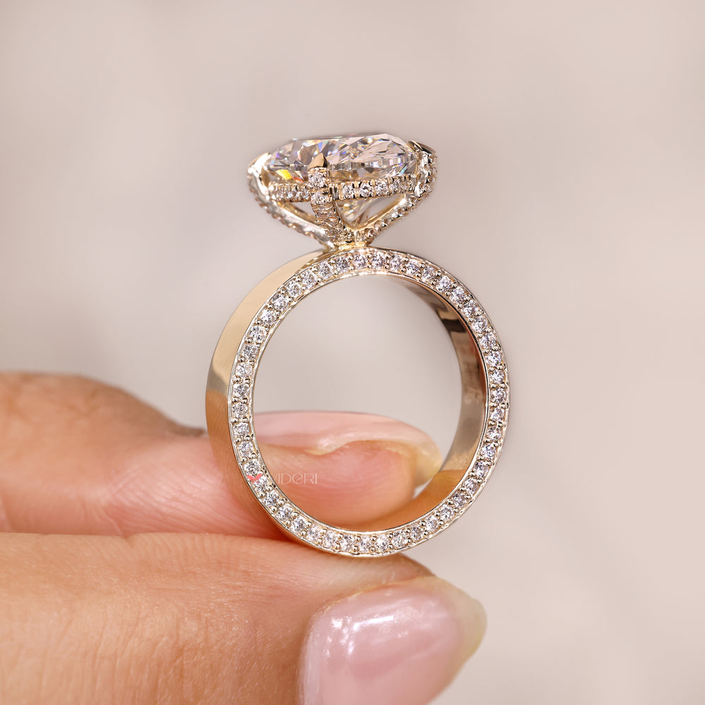 Hidden halo oval diamond ring claw prong set.
