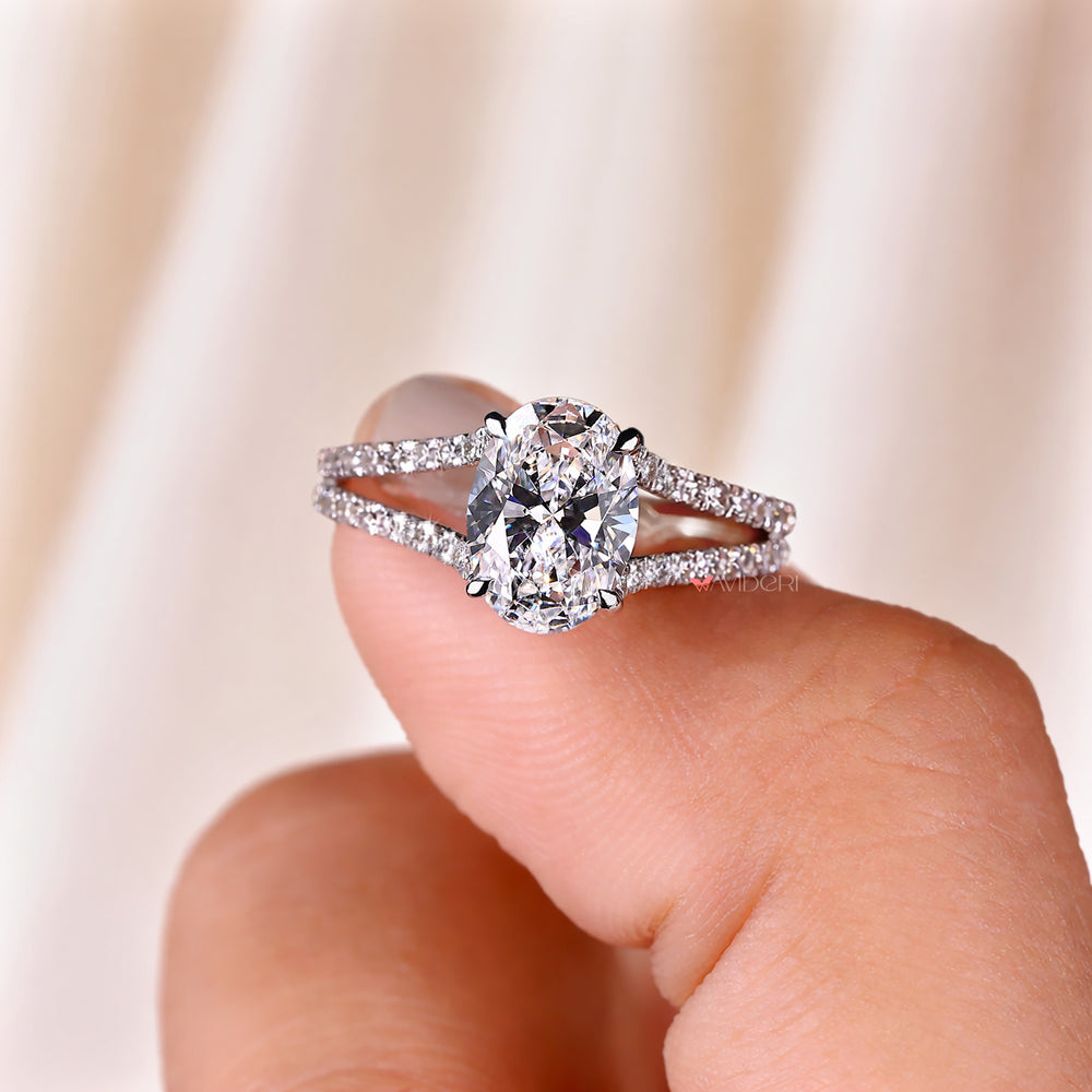 Four claw prong oval cut diamond ring handmade.