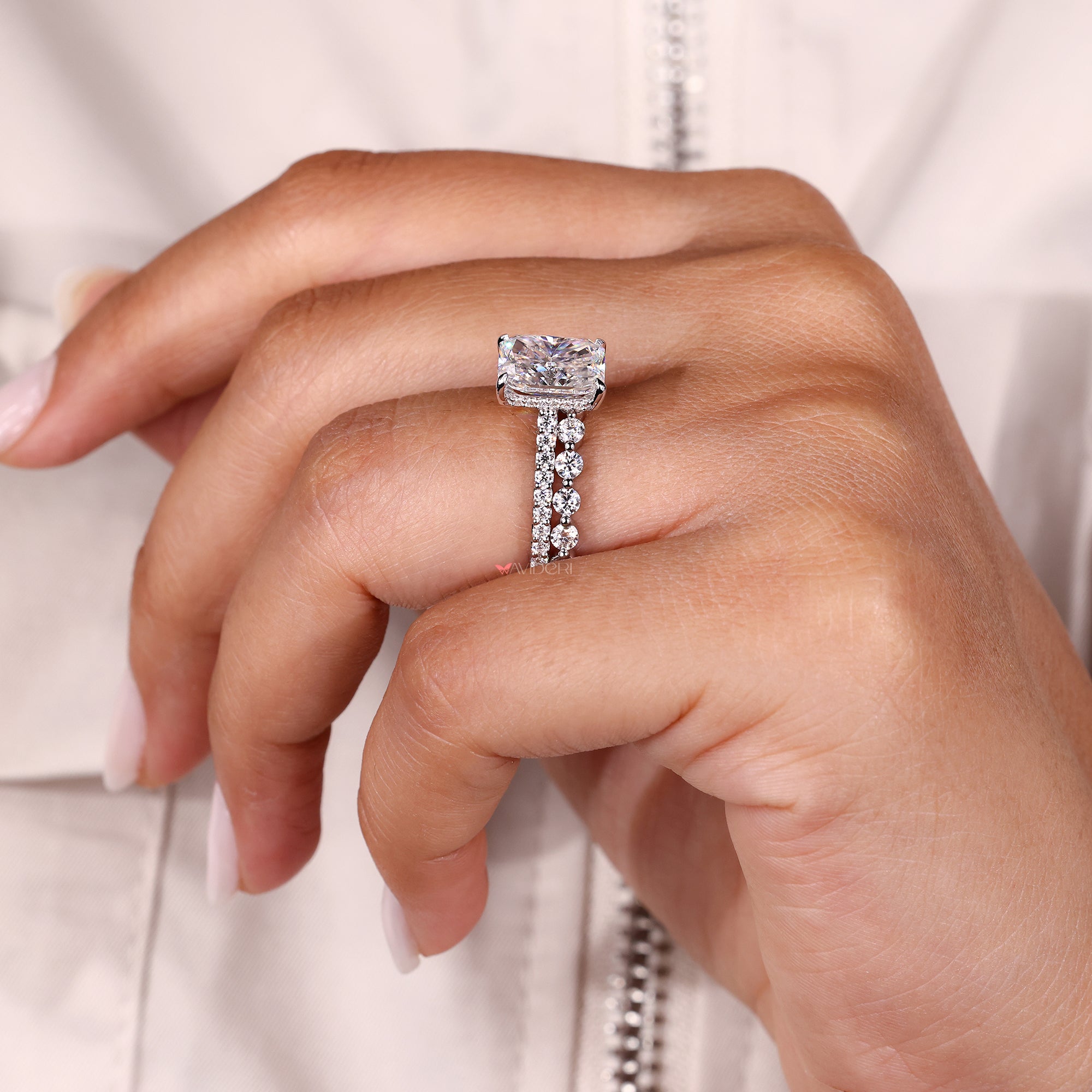 Hidden halo radiant ring with matching pave band.