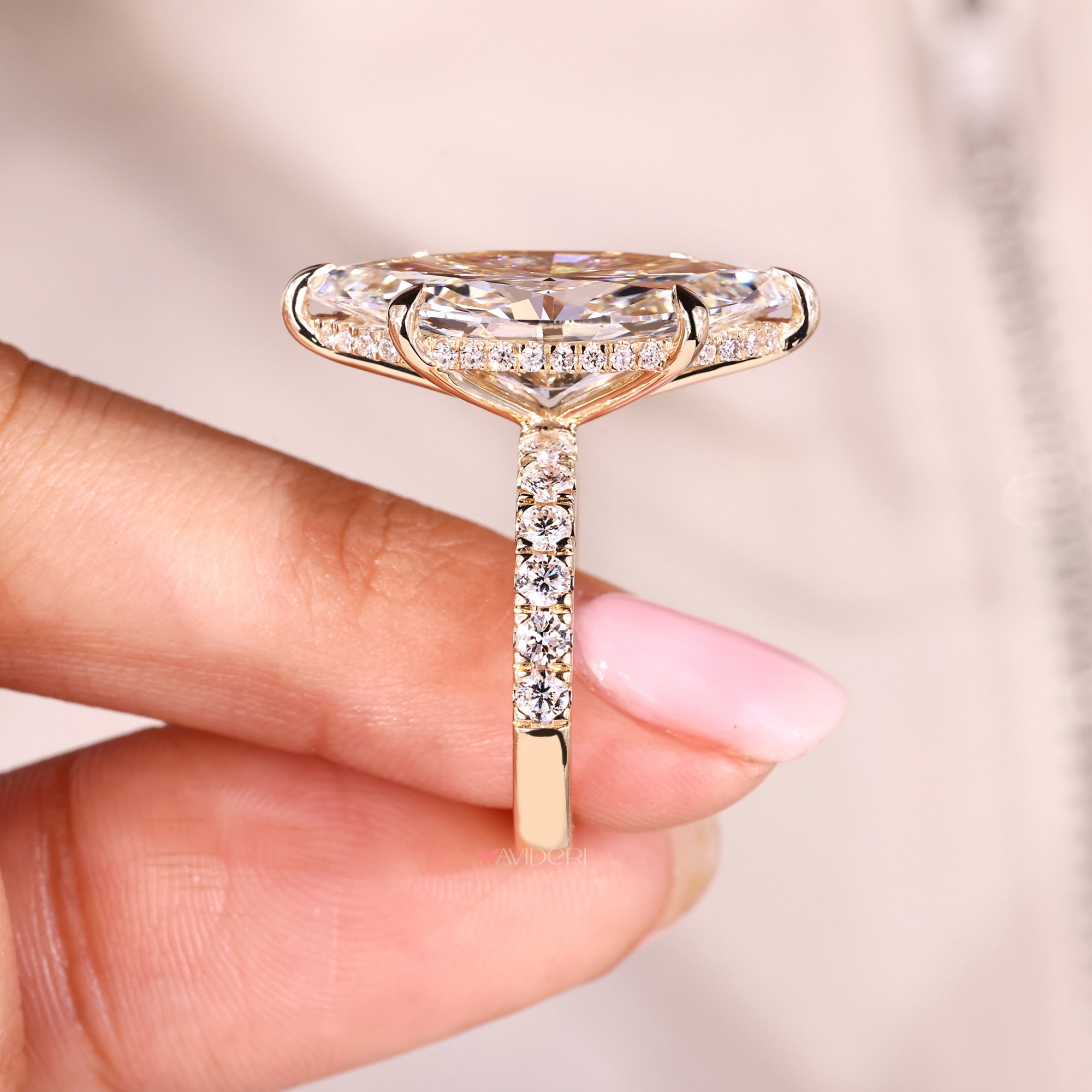 Yellow gold diamond ring with lab-grown diamond ring.