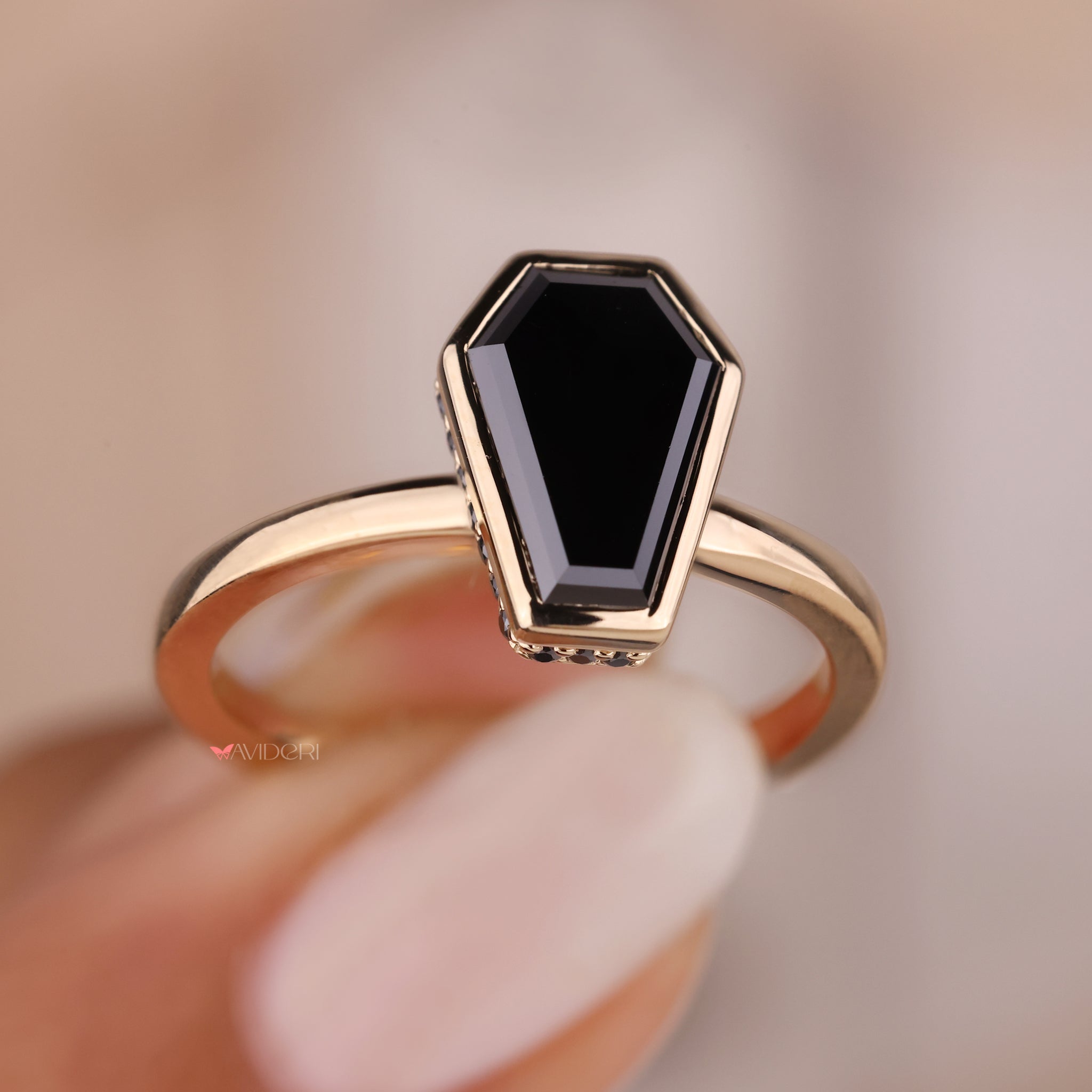 The bezel setting ring provides both modern aesthetics and secure wear.
