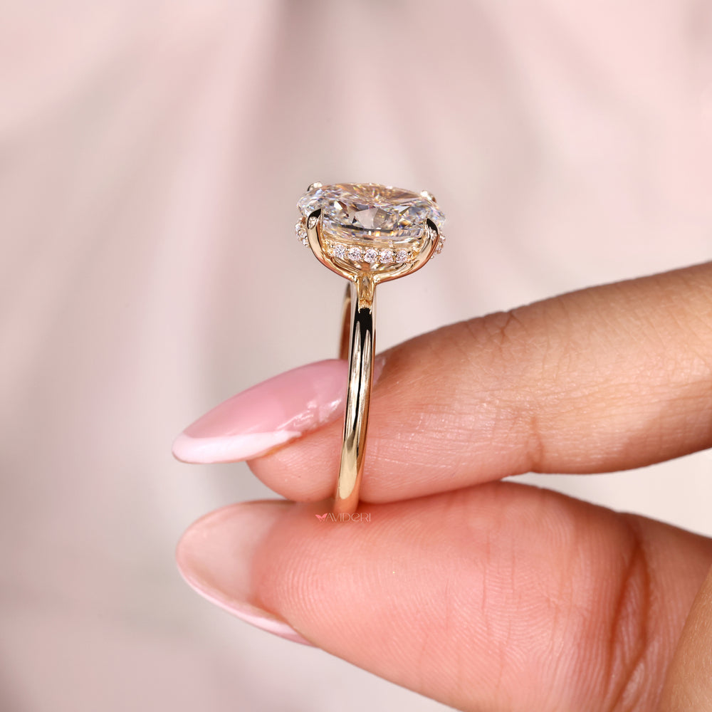 Oval engagement ring with a secure Four Claw Prong ring setting for durability.
