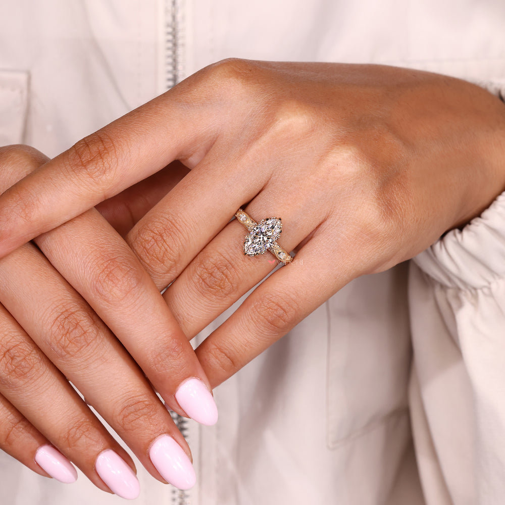 IGI certified marquise ring with round side stone accents
