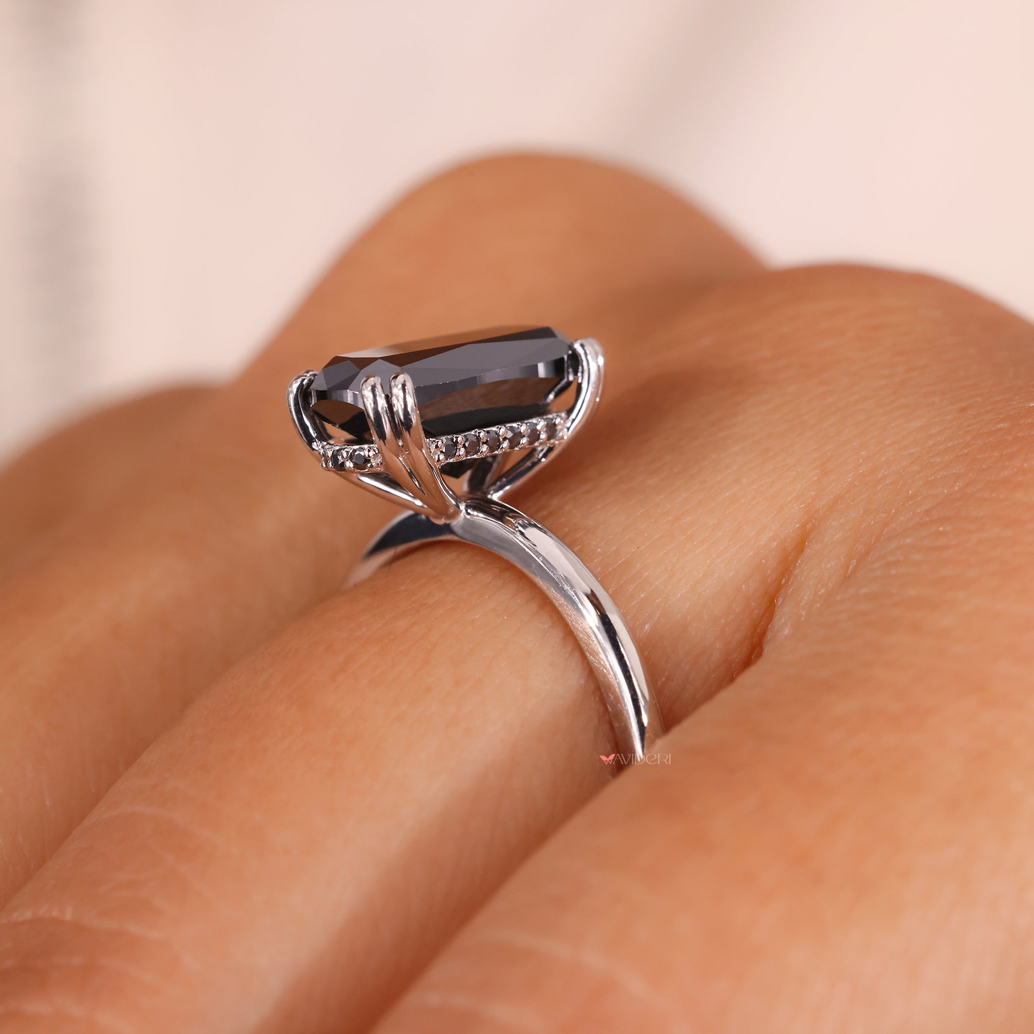 Round cut hidden halo setting sparkles beautifully under soft lighting.
