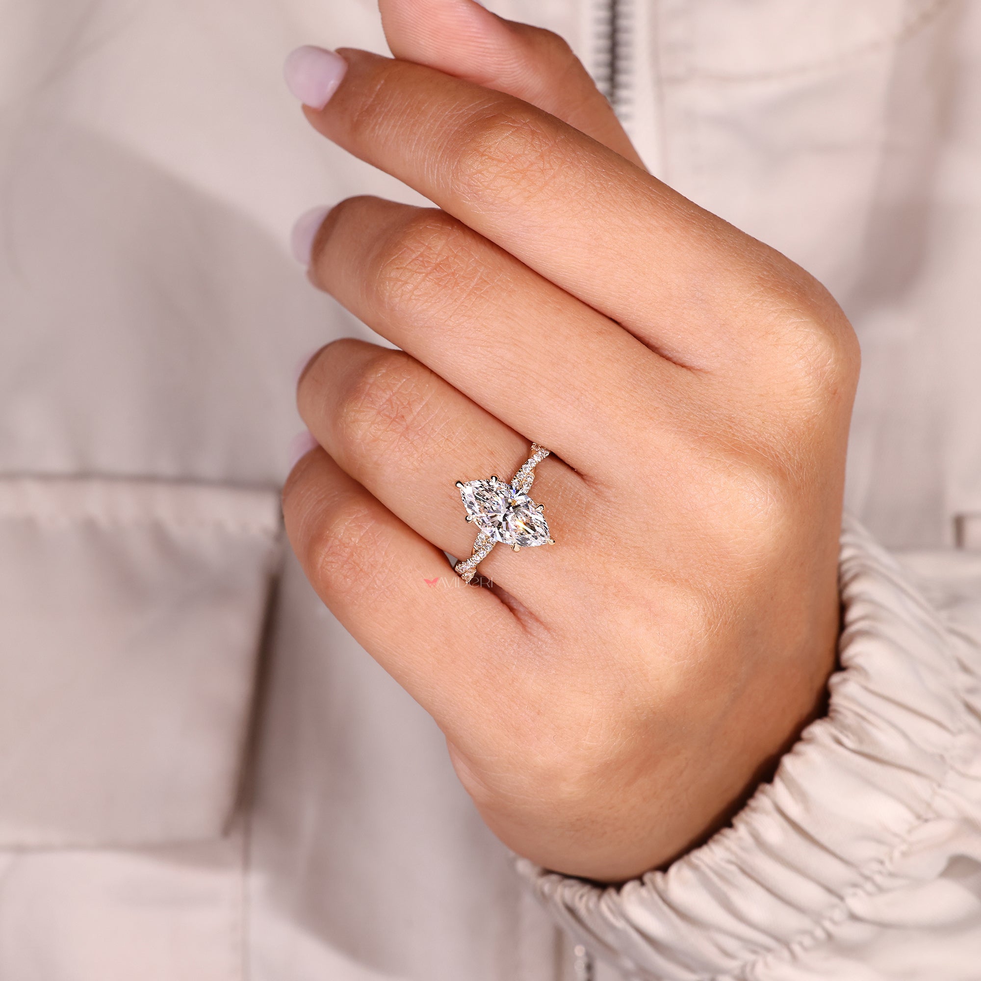 Marquise cut diamond ring with six claw prong setting.
