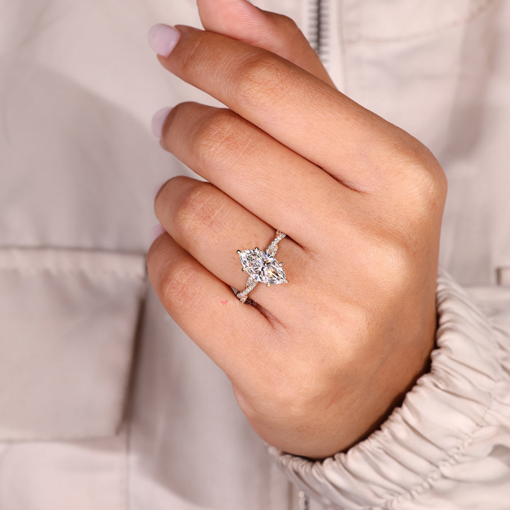Marquise cut diamond ring with six claw prong setting.
