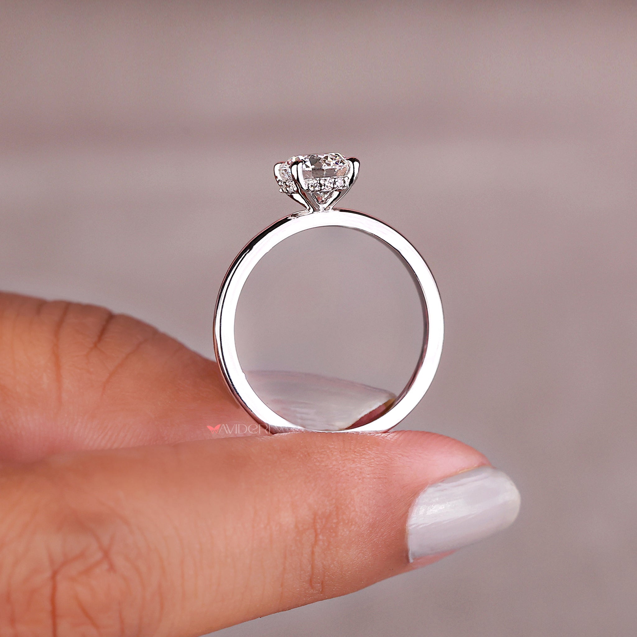Round diamond ring in a white gold engagement ring setting, perfect for modern elegance.