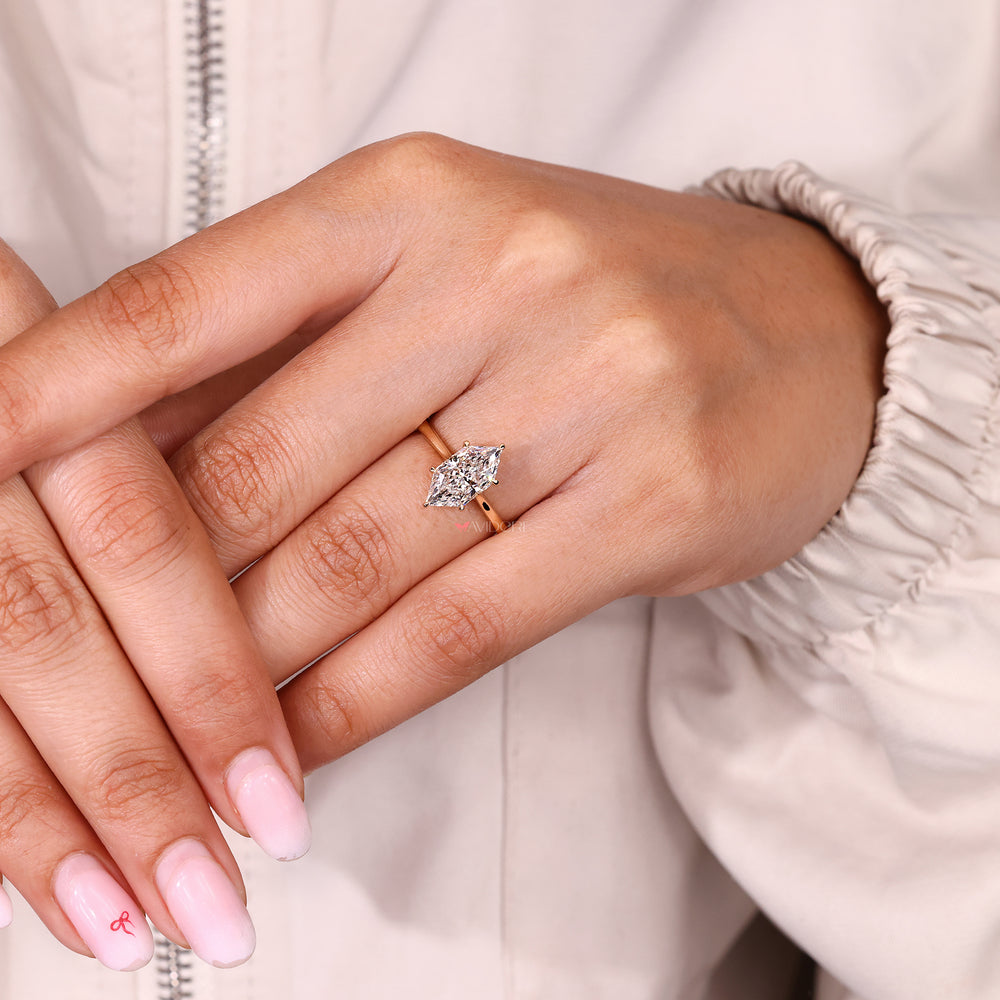 Dutch marquise ring with hidden halo and tapered shank.

