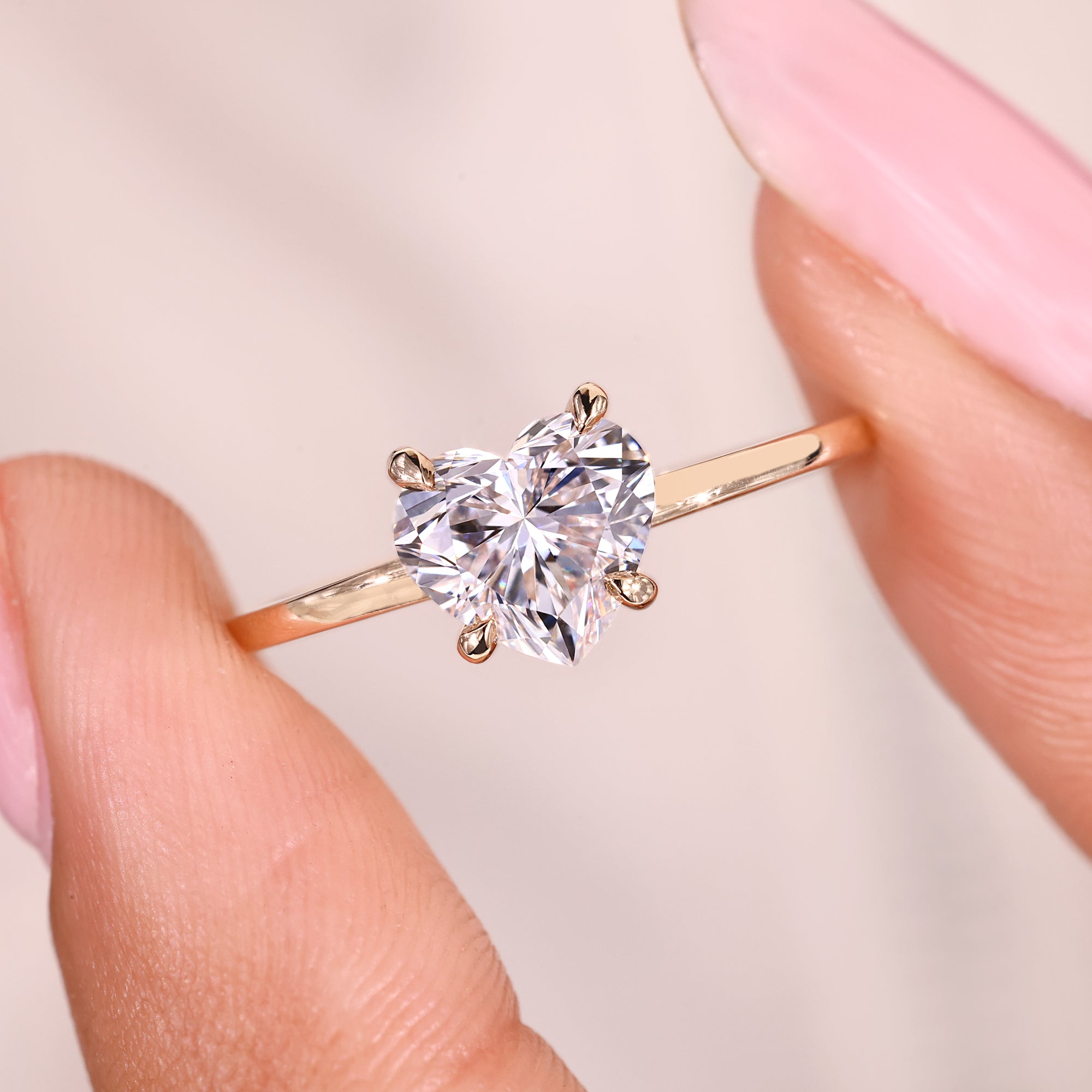 Heart cut diamond ring with hidden halo round diamonds.
