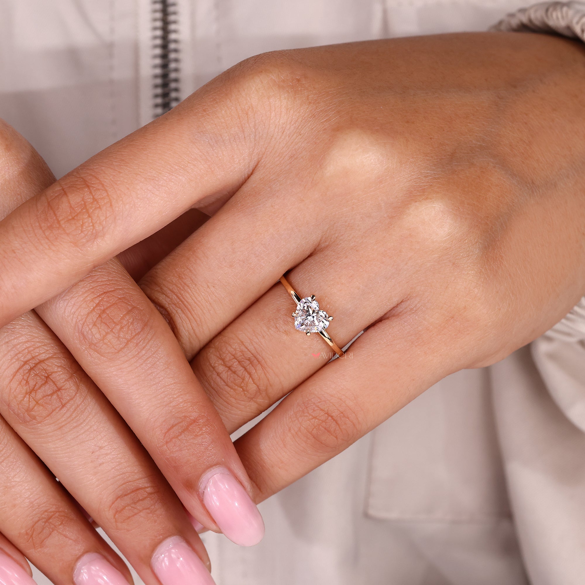 Heart cut diamond ring featuring refined hidden halo detail.
