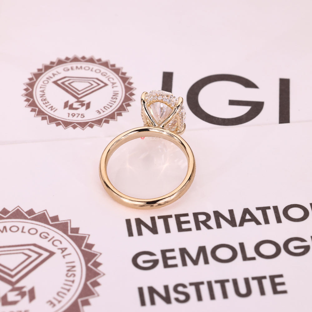 Elegant oval diamond ring with hidden halo setting.
