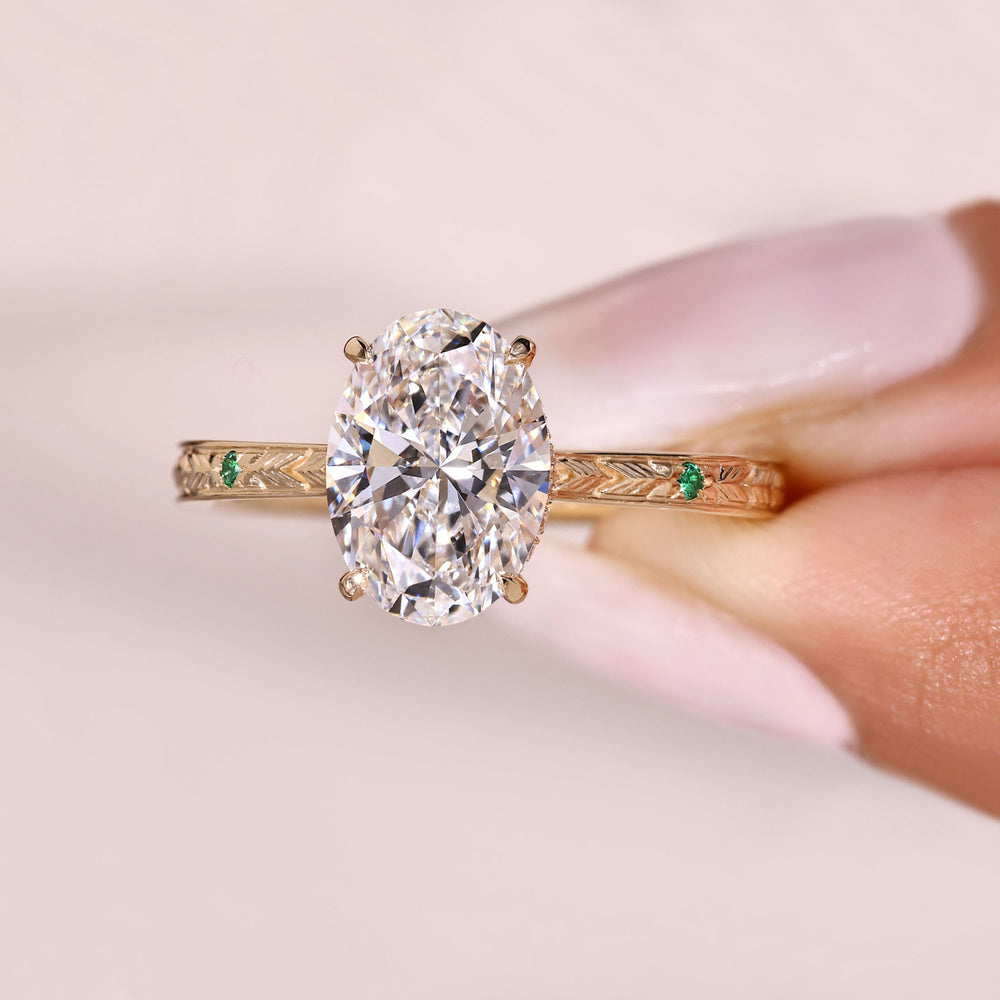 Oval cut diamond ring with round hidden halo accents.
