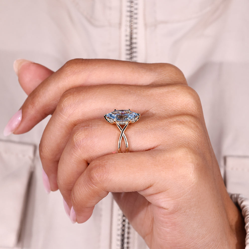 Blue diamond ring with tulip setting style.
