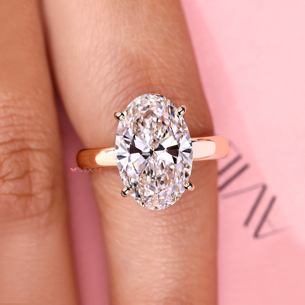 Classic hidden halo oval diamond engagement ring.
