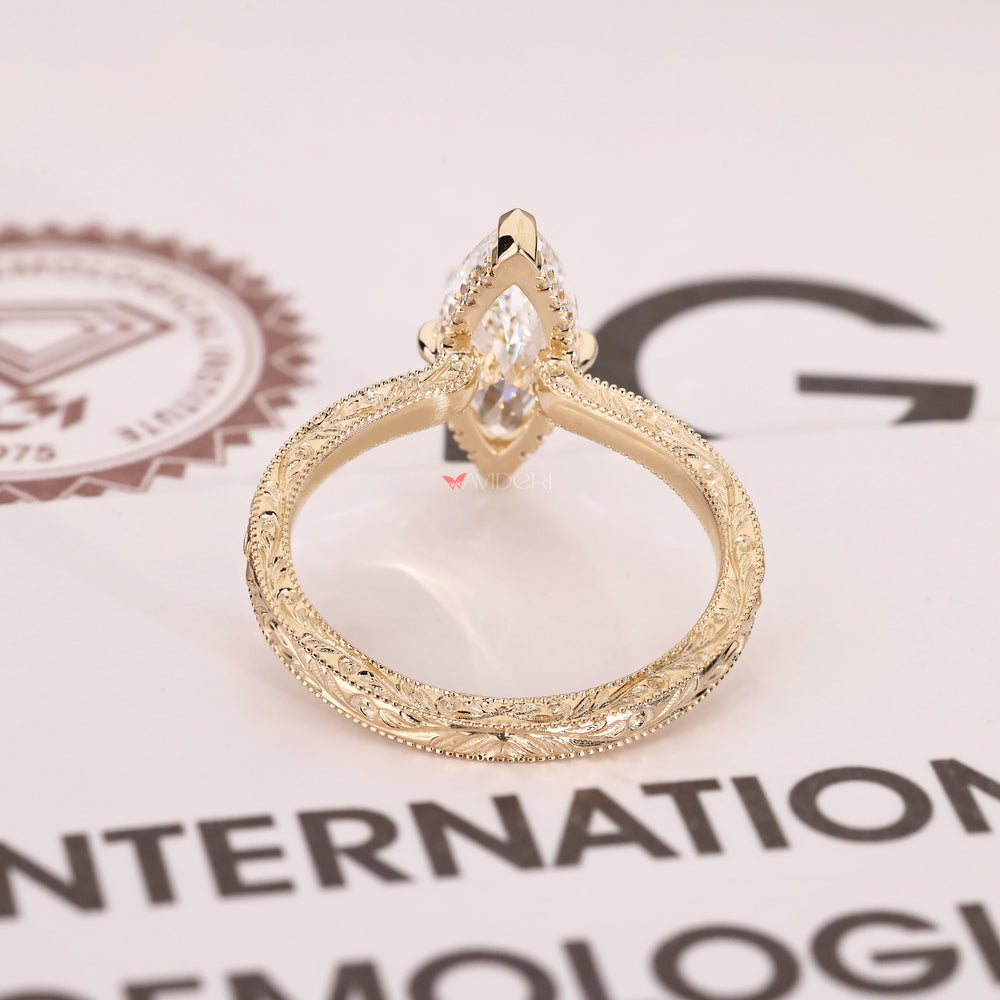 Milgrain marquise diamond ring with open gallery.
