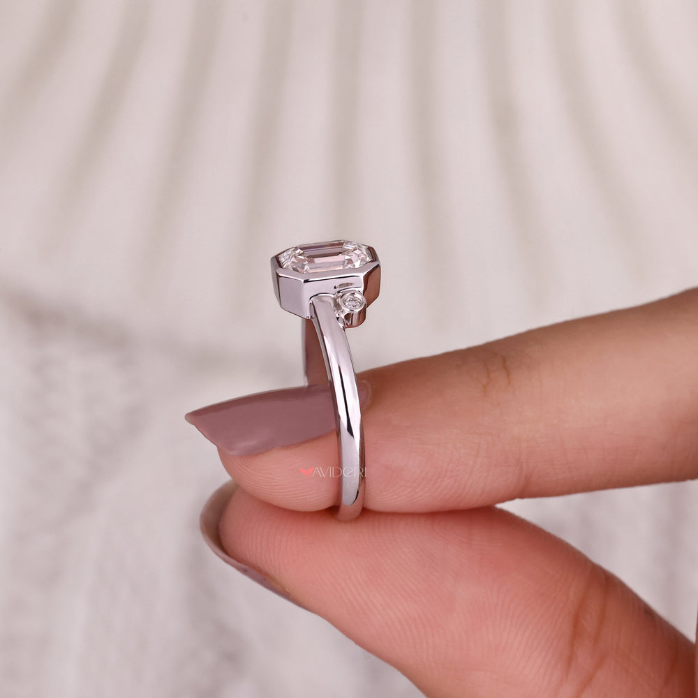 Classic gold emerald cut engagement ring for a timeless look.
