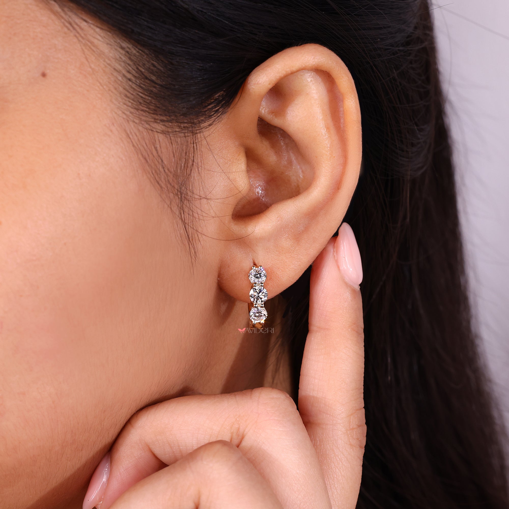 Gold diamond hoop earrings in yellow gold earrings.
