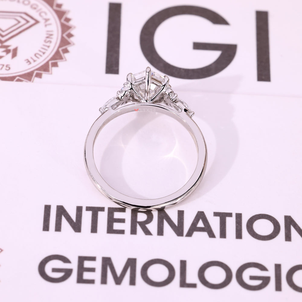 IGI certified seven stone ring with step cut center diamond.