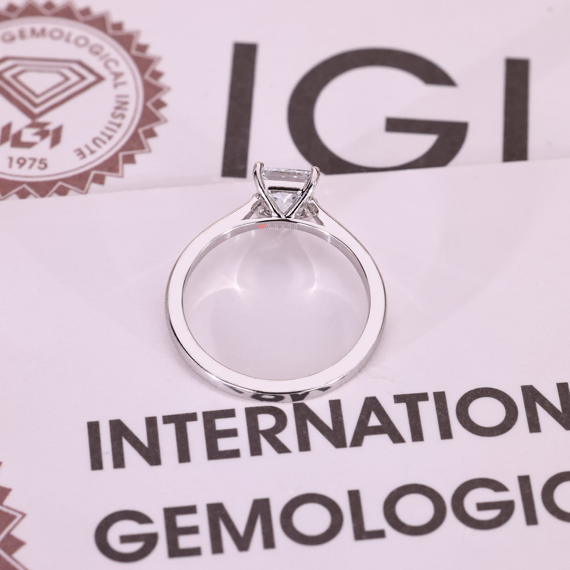 Handmade princess cut diamond ring with tapered shank.
