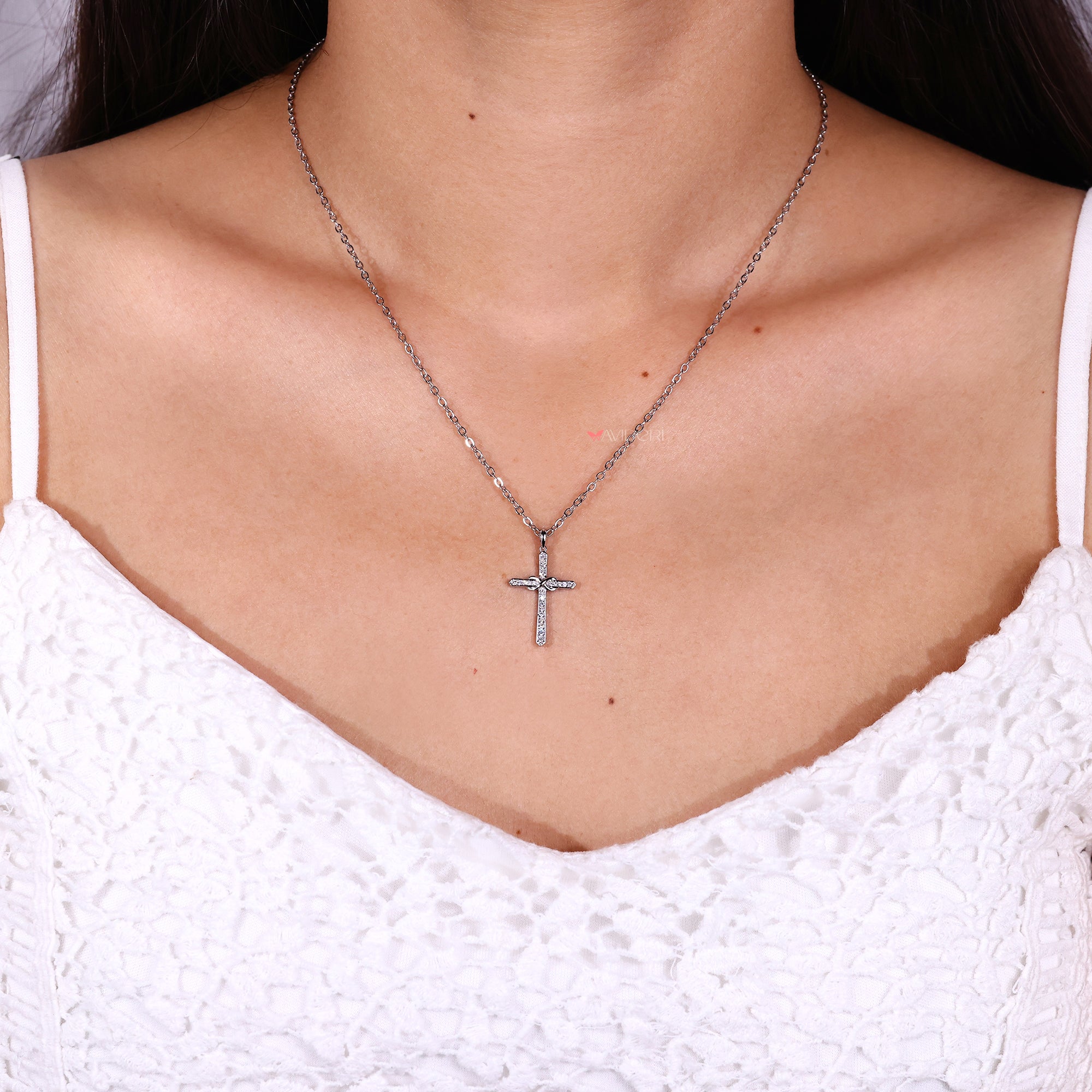 Diamond cross pendant in white gold.