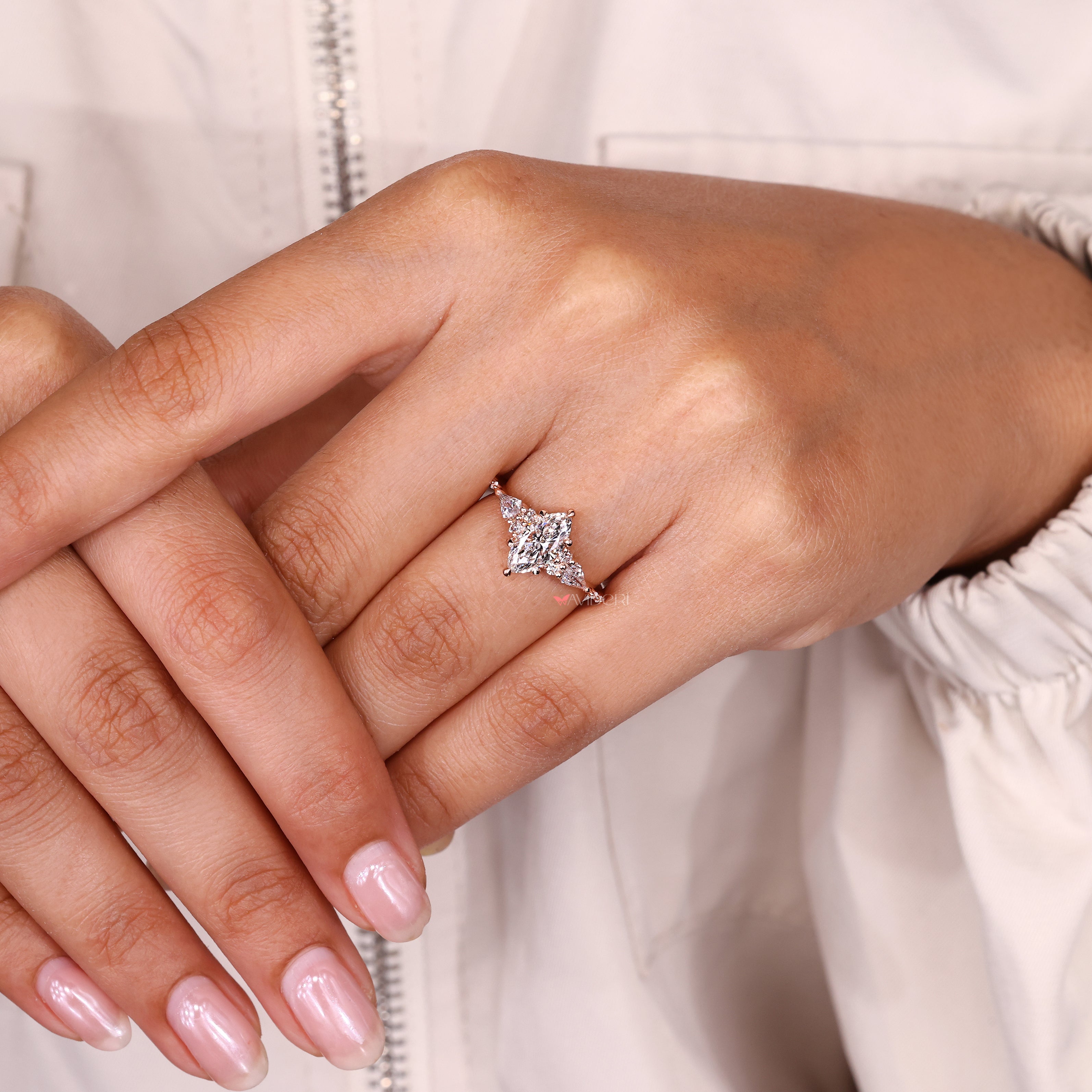 Handmade marquise ring with side stones design.
