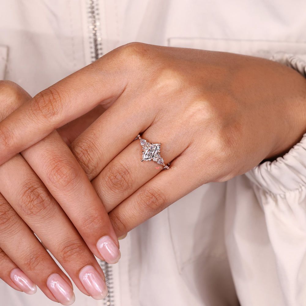 Handmade marquise ring with side stones design.
