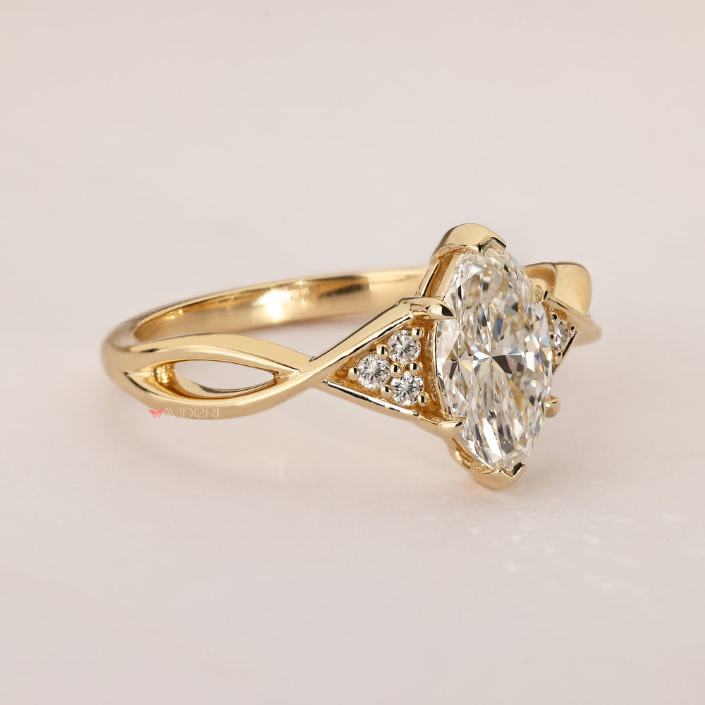 Marquise diamond ring with basket style setting.
