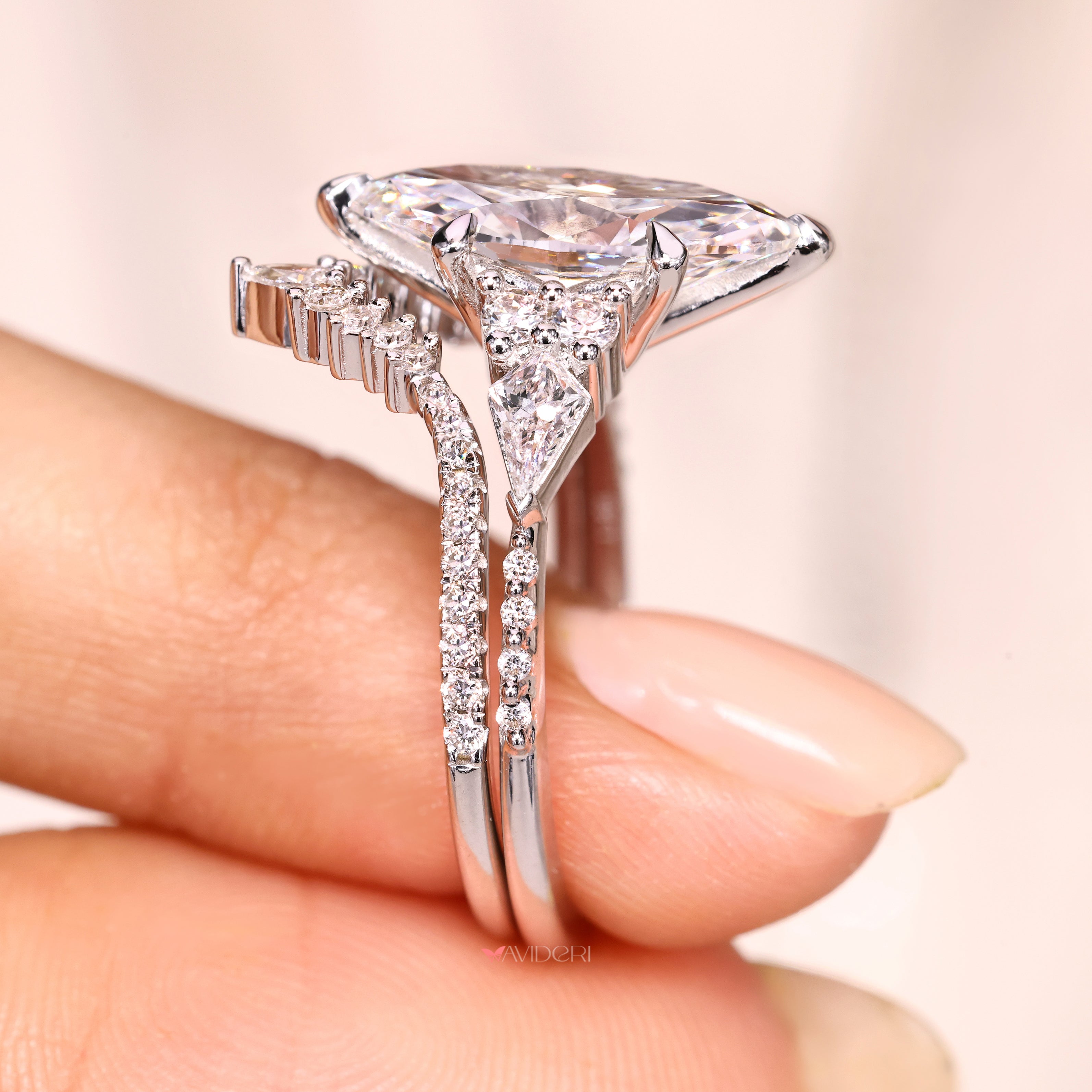 Marquise ring with pear round diamond band.

