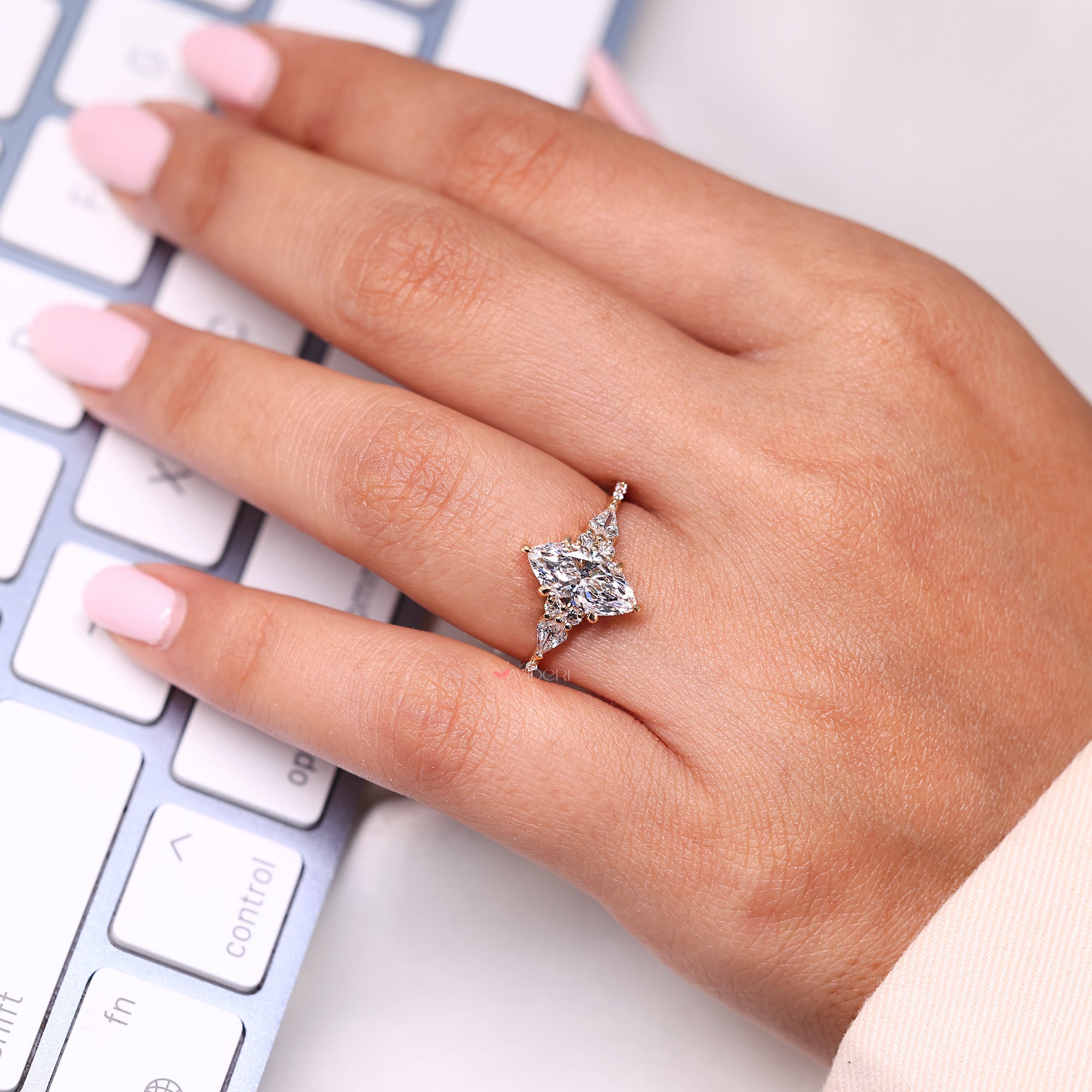 Marquise diamond ring with side stones.