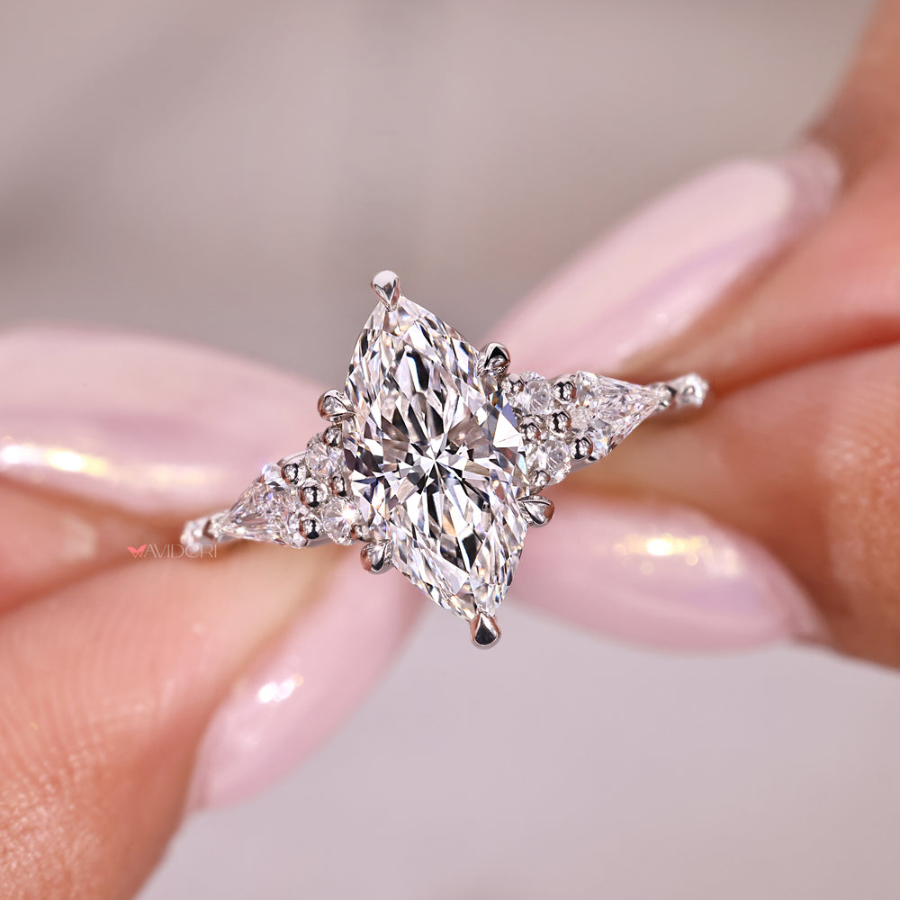 Round and Kite side stones create beautiful contrast and sparkle.