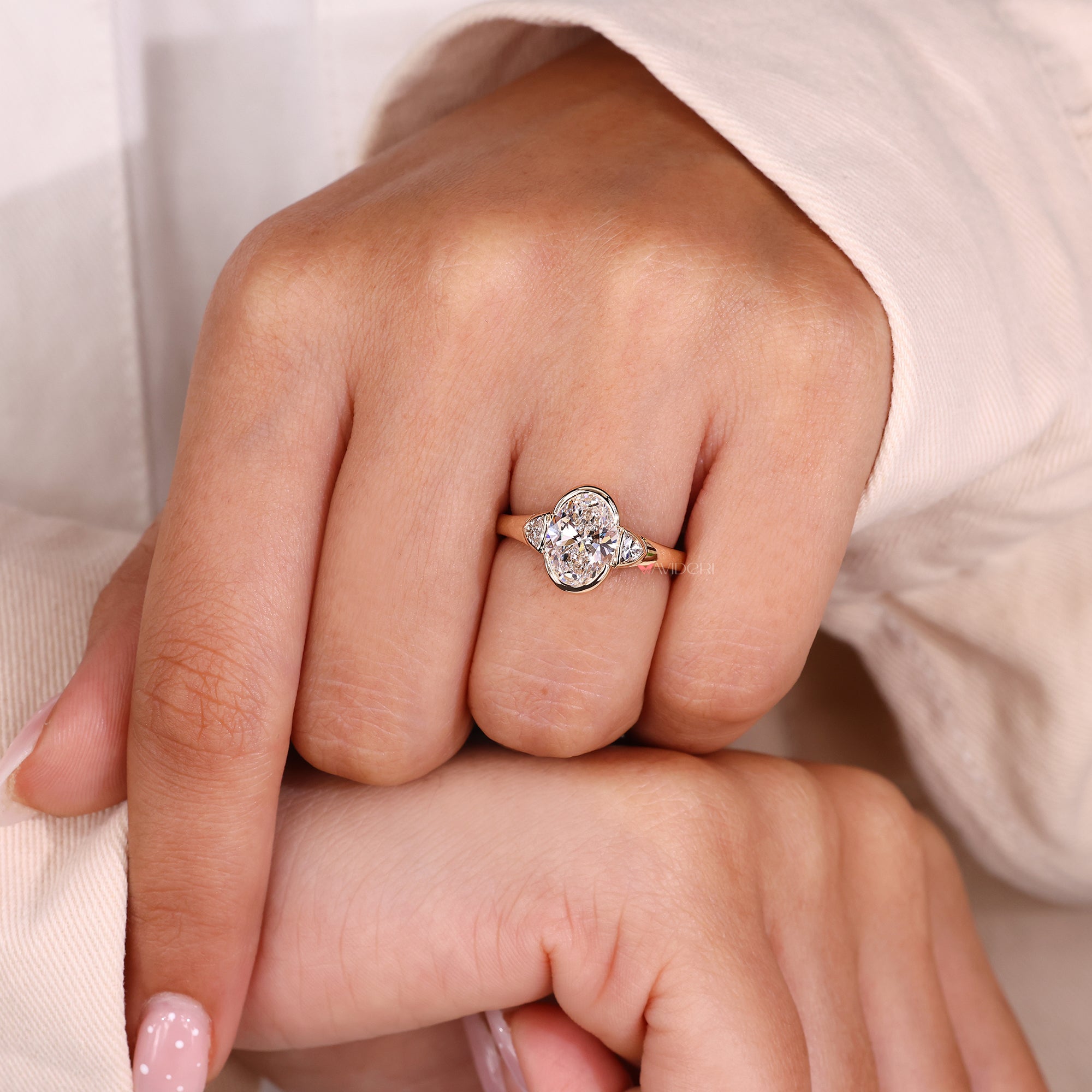 Half bezel setting on a tapered shank ring.