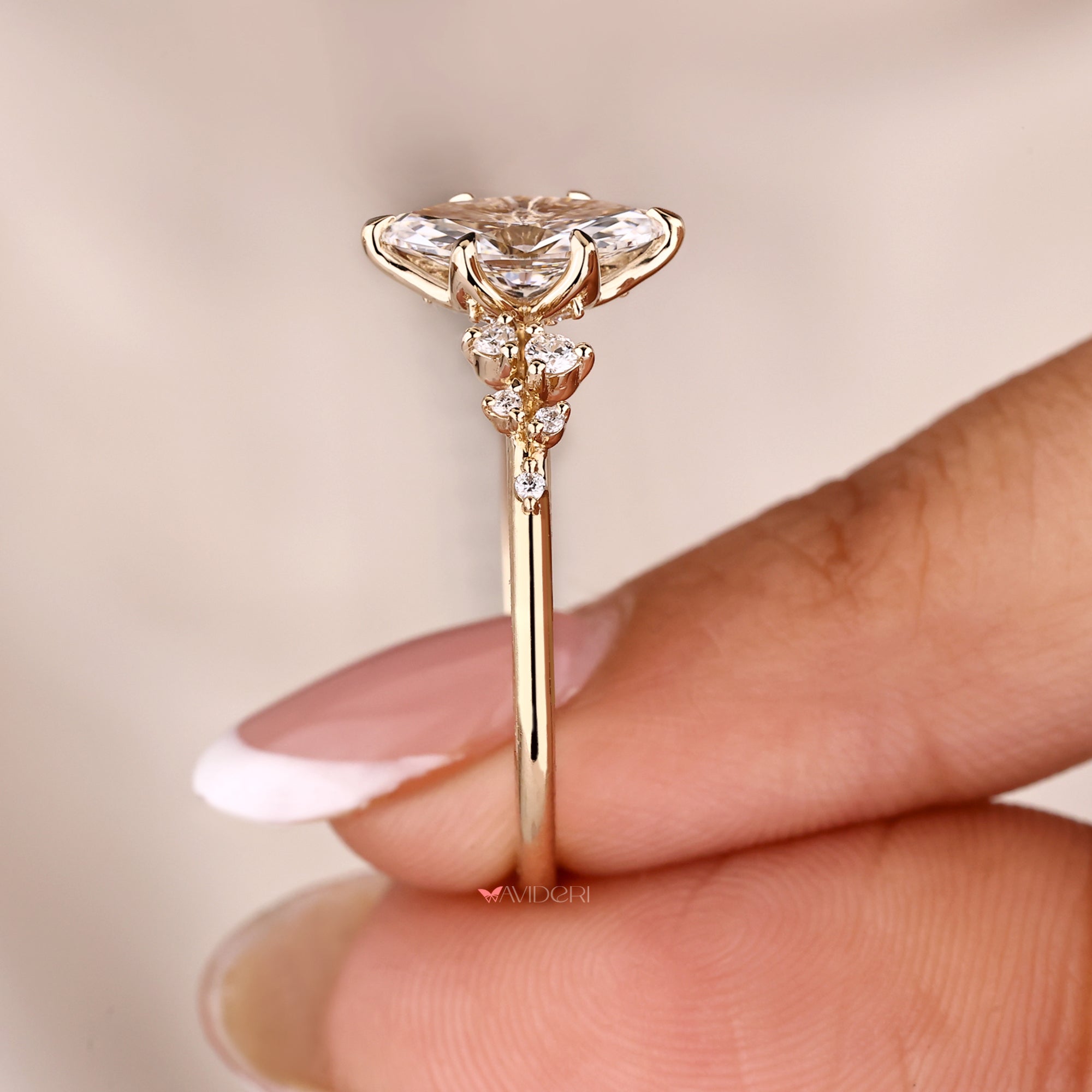 Yellow gold engagement ring with round cut side diamond.