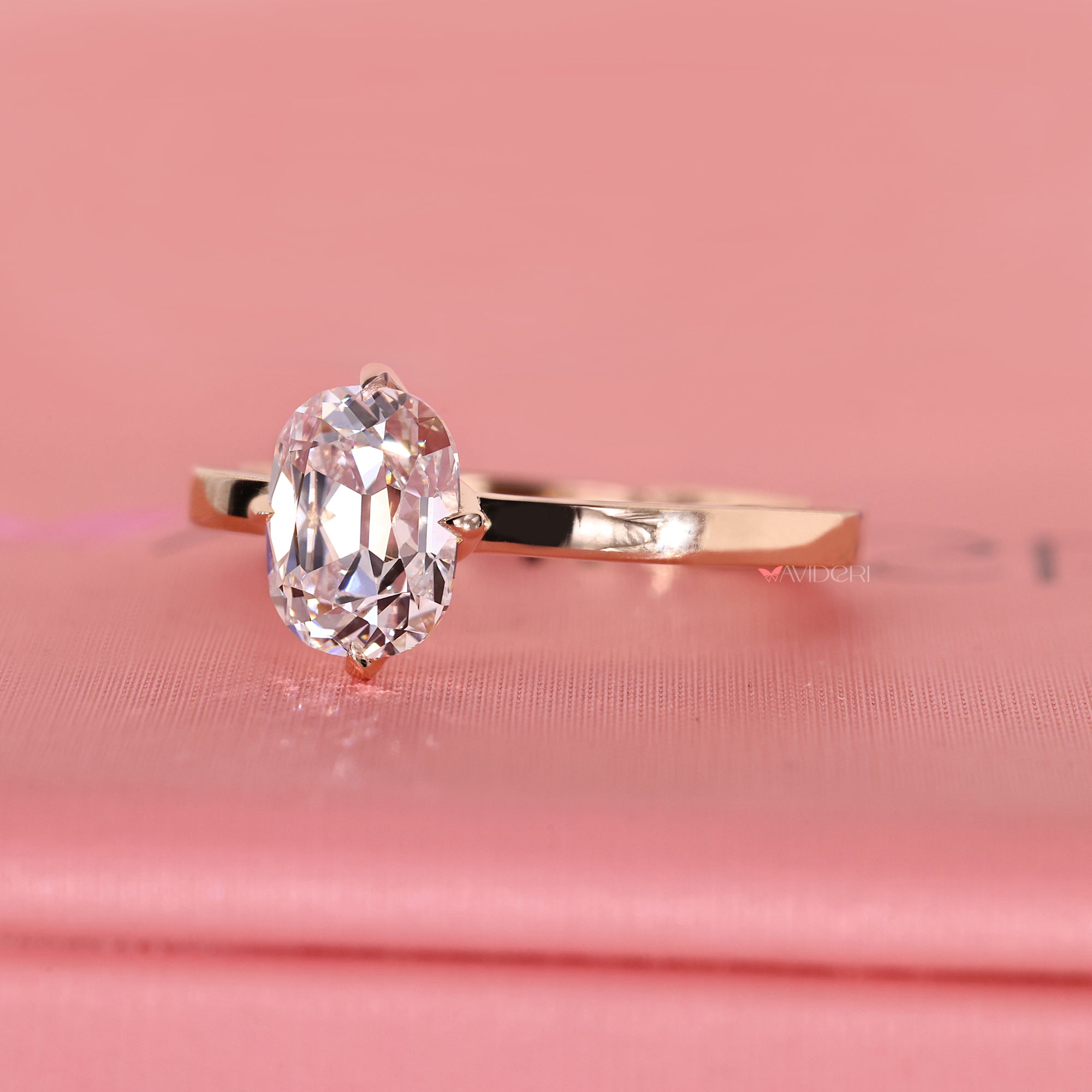 Solitaire diamond ring in compass prong setting.