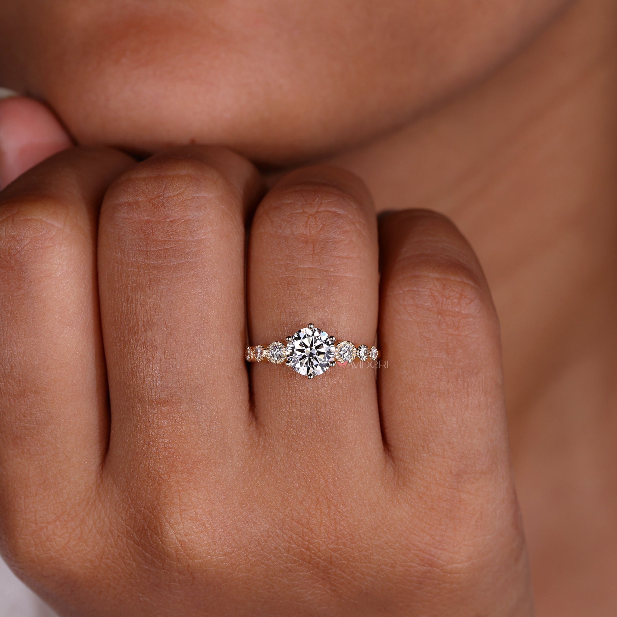 IGI certified avideri ring showcasing a round brilliant cut diamond ring in a stunning tapered pave engagement ring style.
