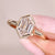 Hexagon step cut diamond ring with bezel setting ring.

