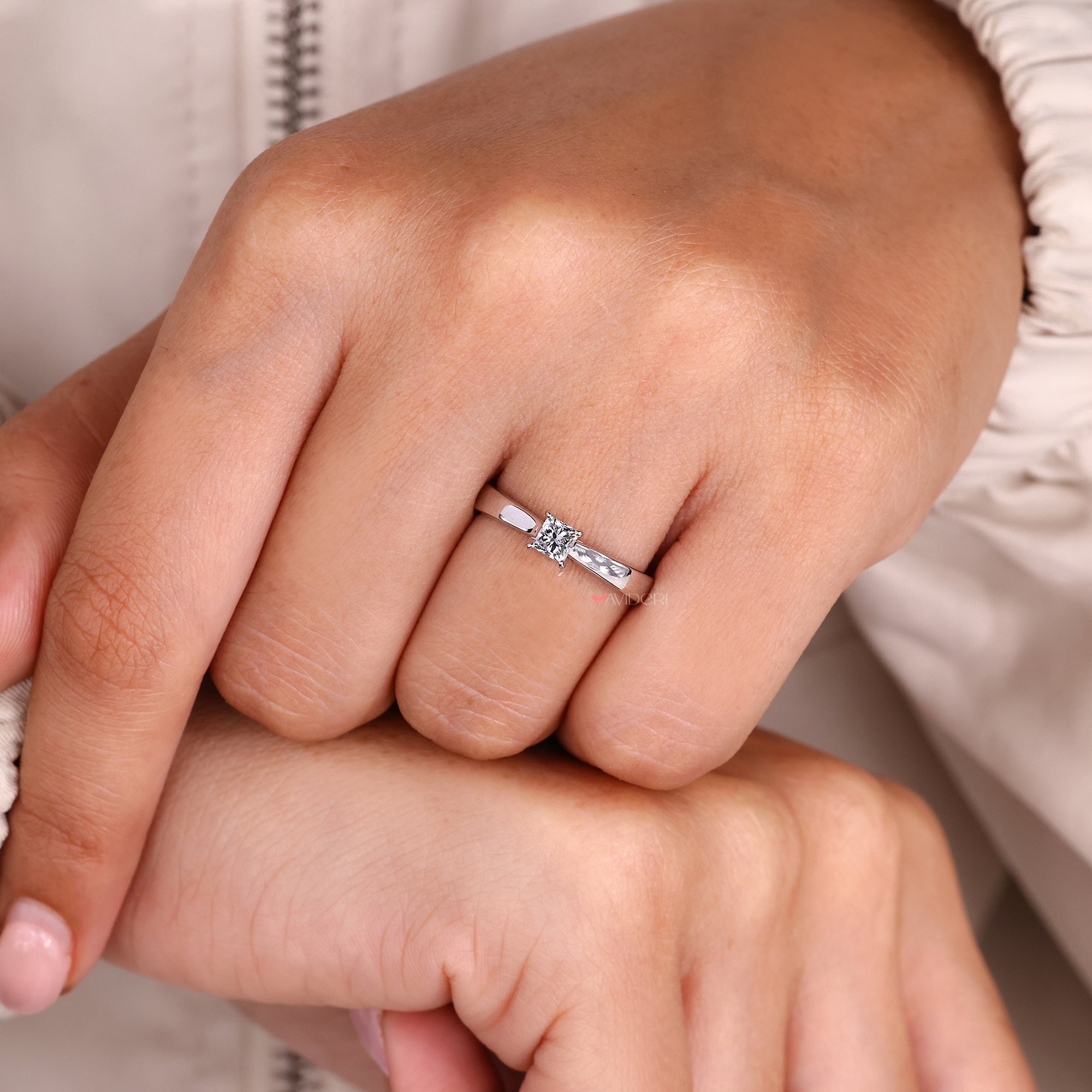 White gold diamond ring with princess cut solitaire ring.