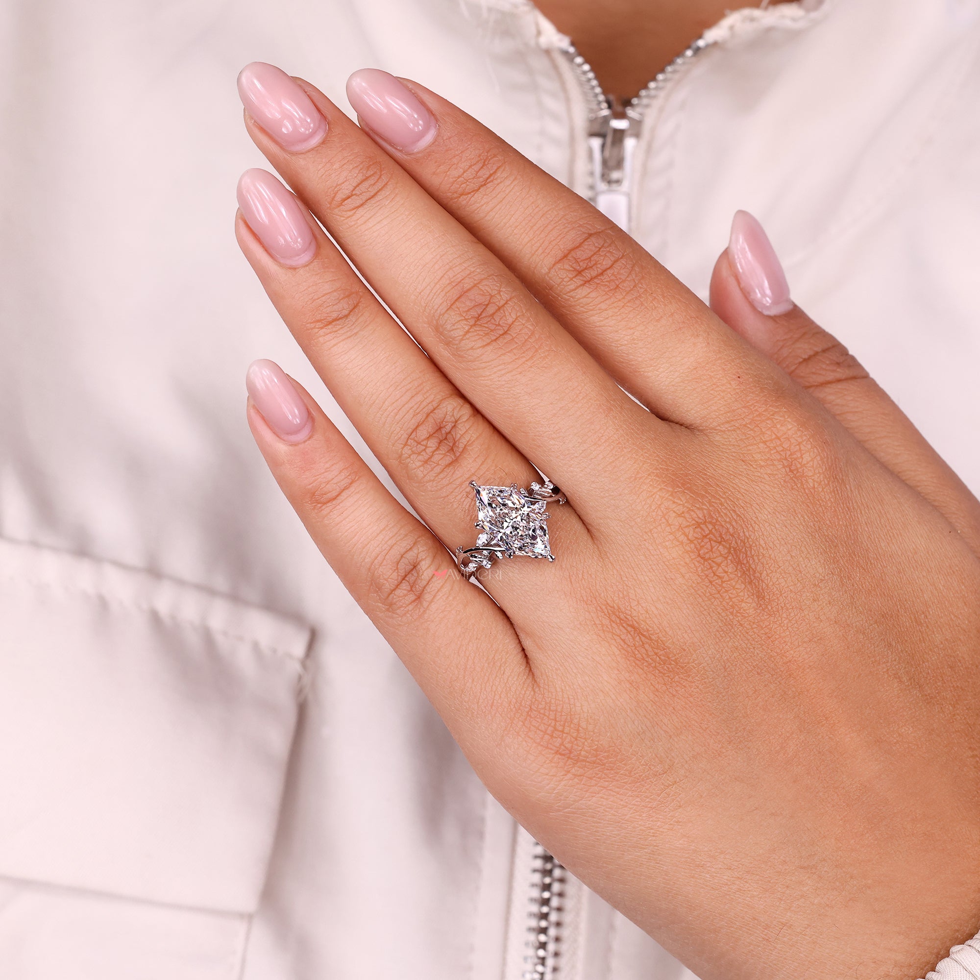 Lab-grown ring with cluster diamond ring.
