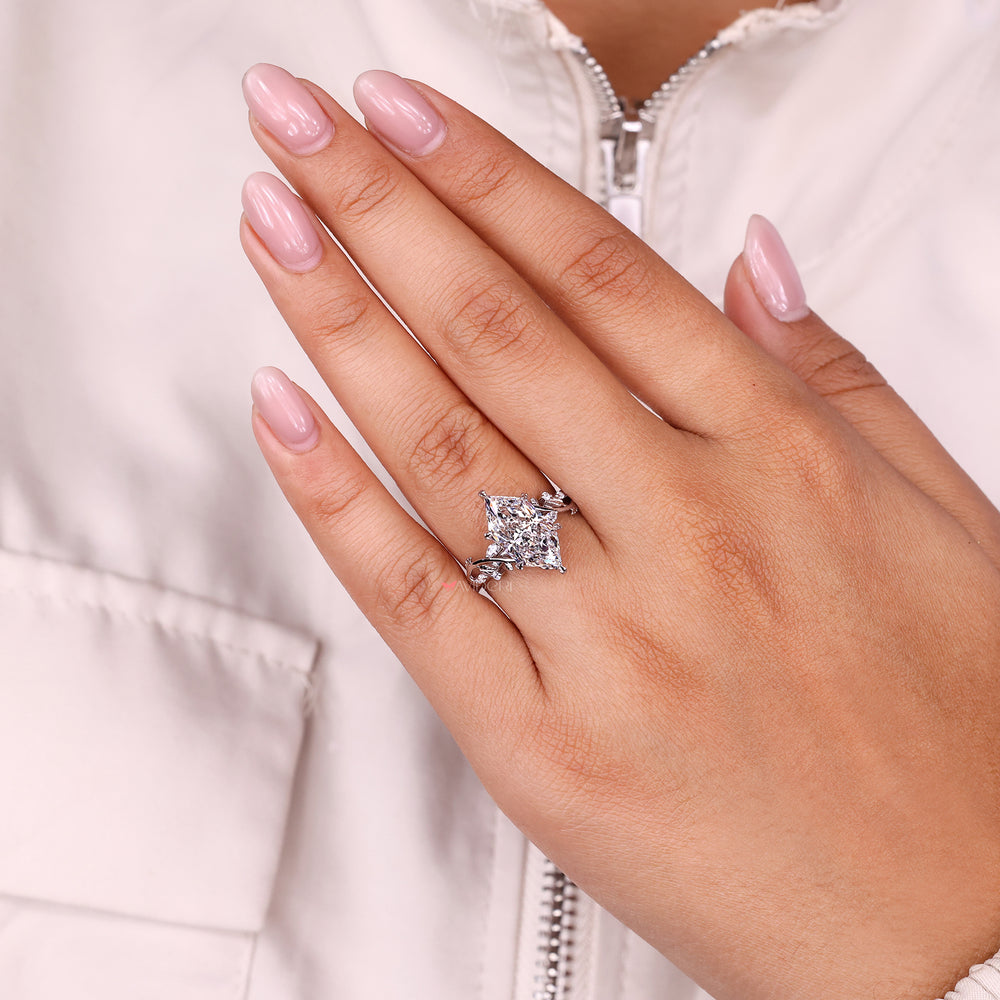 Lab-grown ring with cluster diamond ring.
