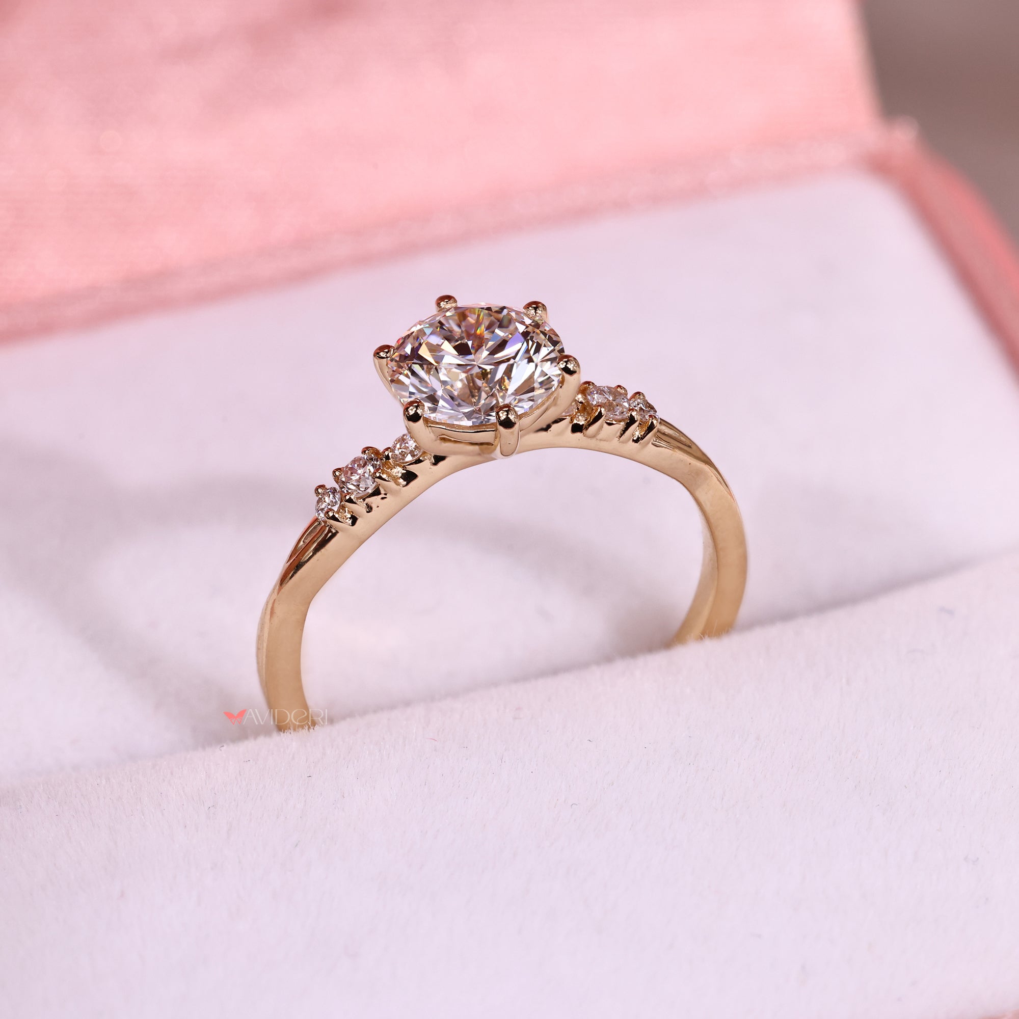 Avideri ring featuring a six prong diamond ring and round cut diamond in an elegant twisted shank setting.